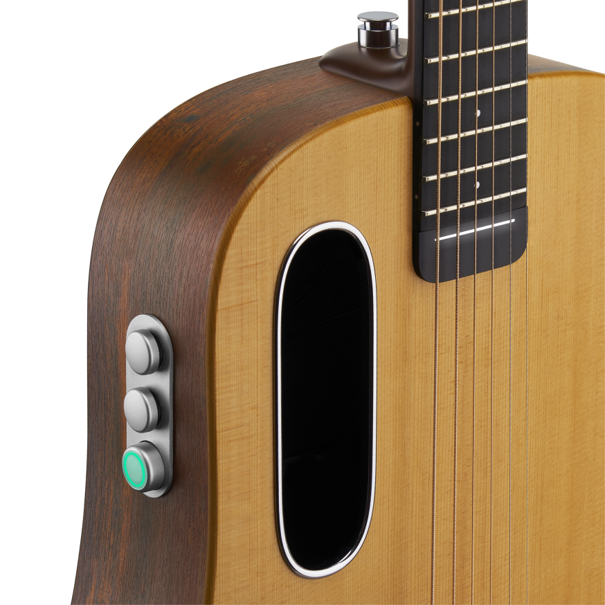 LAVA ME Air Spruce body close-up with oval sound port, spruce top grain and side control buttons