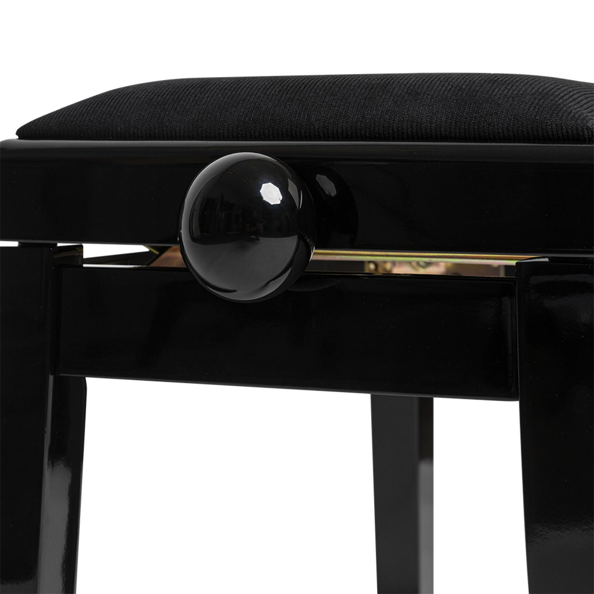 Close-up of the highgloss black height adjustment knob on the Stagg PB06 piano bench
