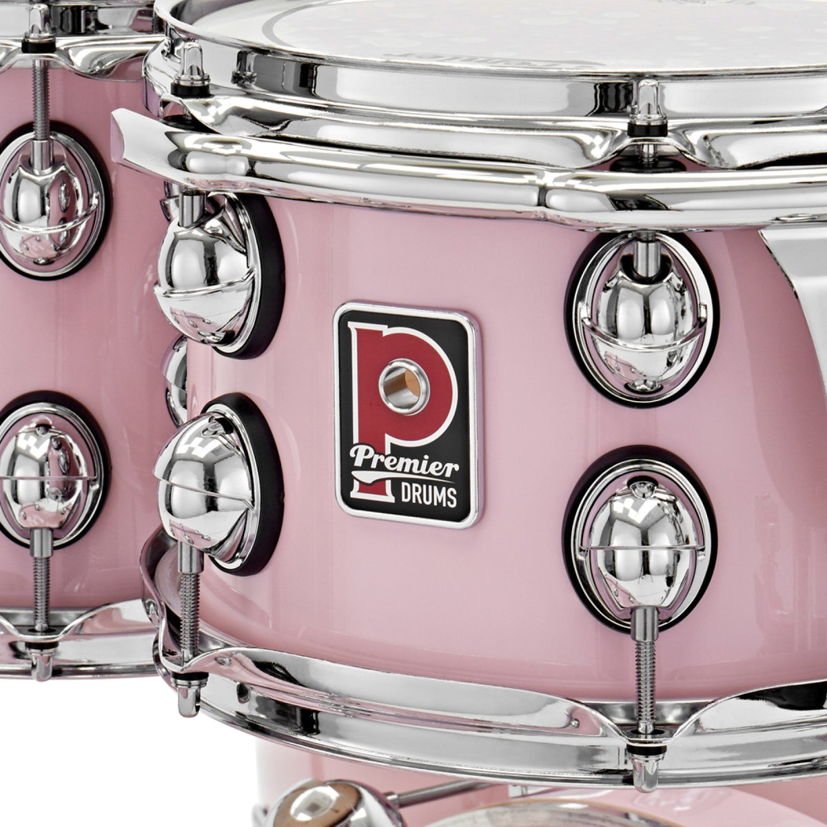 Close-up of the Premier badge, tension lugs and triple-flange hoop on a Pink Premier Genista Maple rack tom