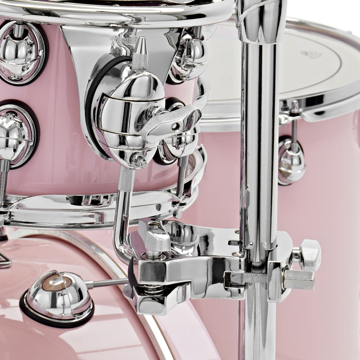 Close-up of the tom holder clamp and mounting bracket on a Pink Premier Genista Maple tom