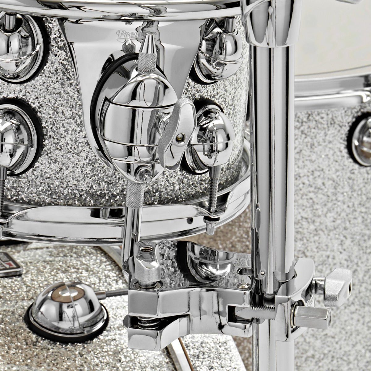 Close-up of the tom holder clamp and mounting bracket on a Silver Sparkle Premier Genista Maple tom