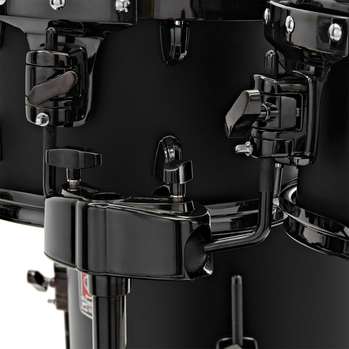 Premier Artist 22" five-piece shell pack in Matt Black (10/12/16/22): close-up of the black nickel tom holder and bass drum bracket