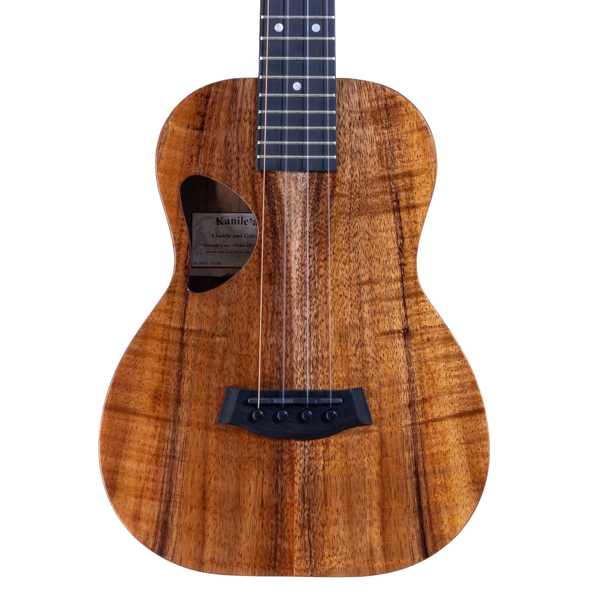 Upper bout of Kanile'a D-1 Pro 6-string tenor ukulele serial 30186 showing the koa top grain, D-shaped soundhole and oval side sound port