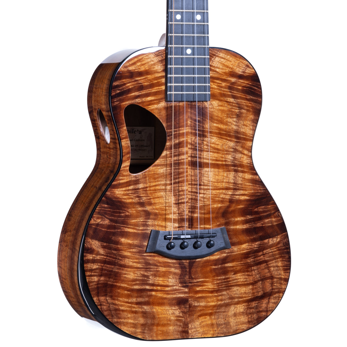 Close-up of the figured koa top, ebony bridge and D-shaped soundhole with oval side sound port on Kanile'a DK-T Pro tenor ukulele, serial 30299