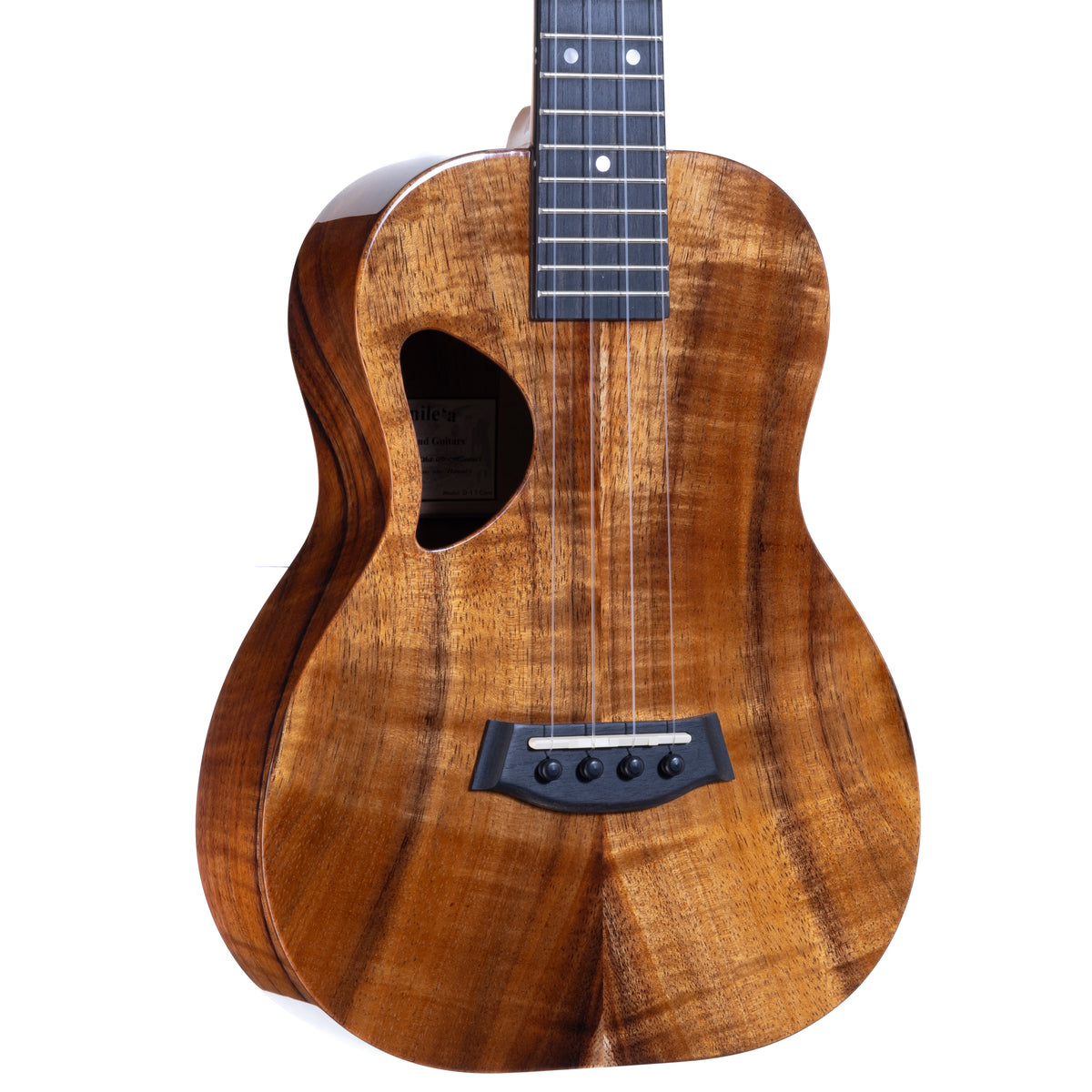 Close-up of the Hawaiian koa top, ebony bridge and D-shaped soundhole on Kanile'a D-1 Deluxe tenor ukulele, serial 30132