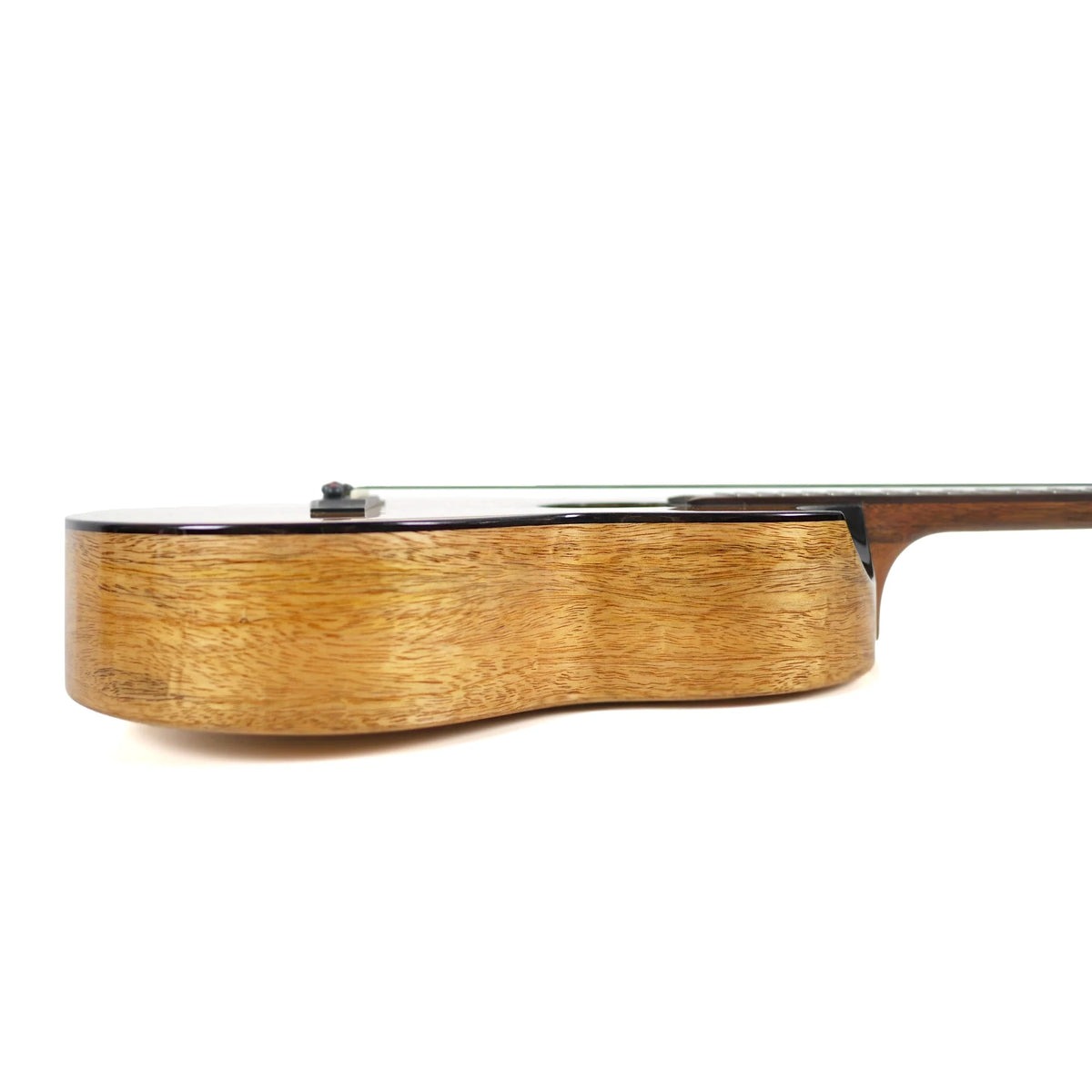 Side profile of the Flight Fireball EQ-A, showing the mango sides, black binding and the cutaway (ukulele #9)