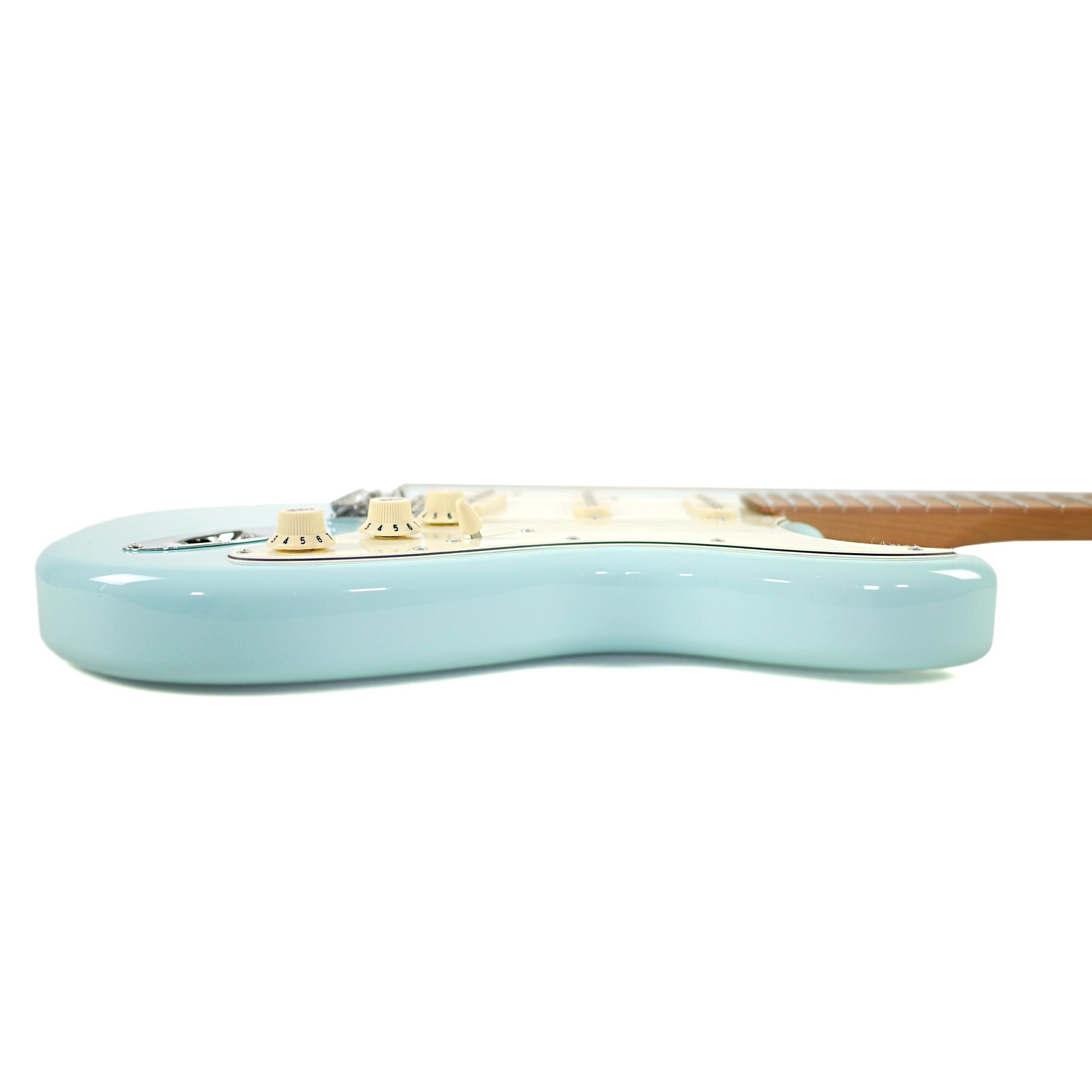 The side view highlights the contoured basswood body and glossy Sonic Blue finish.