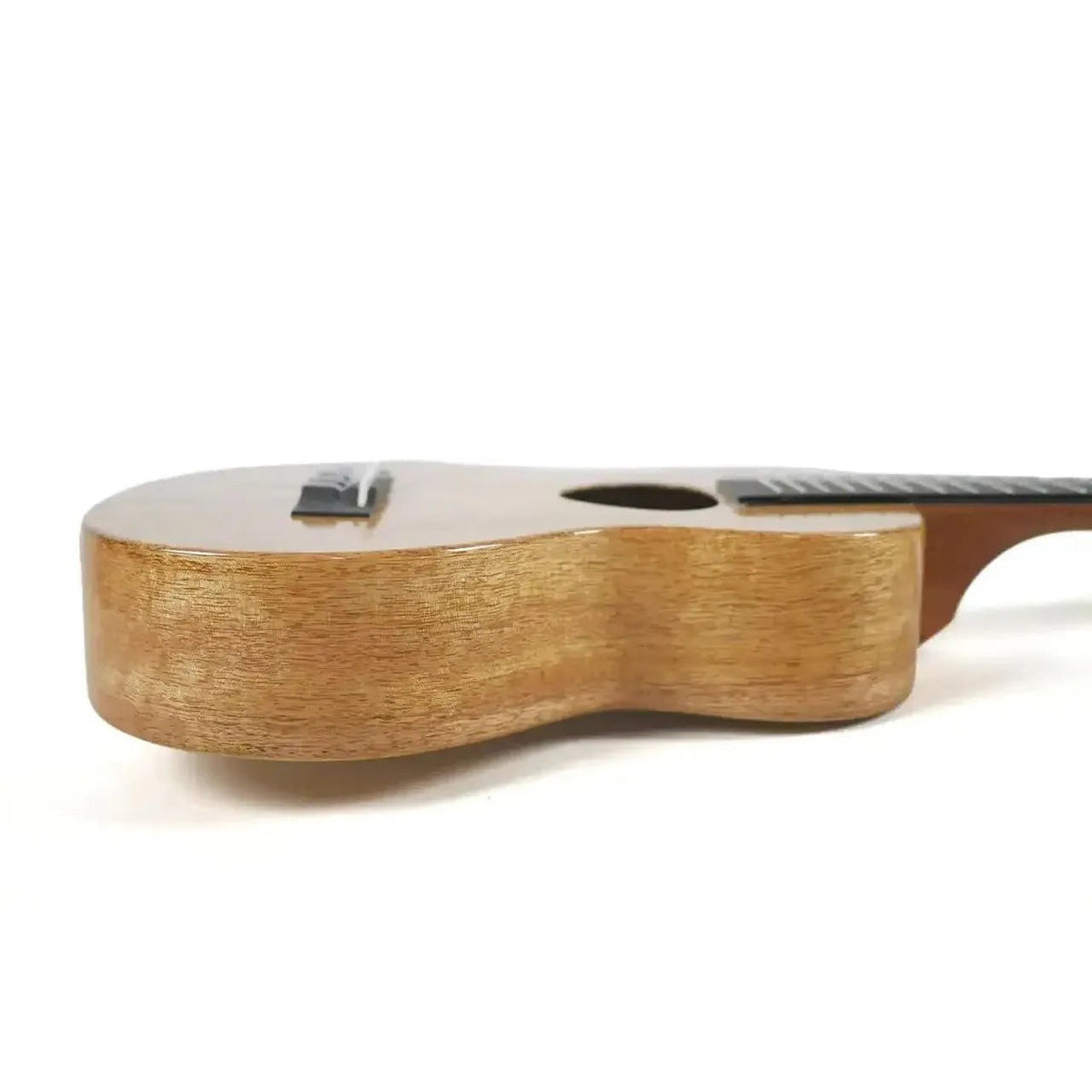 Example photo: side view of a KoAloha KCM-00MG, the gloss version of the KCM-10MG solid mango concert