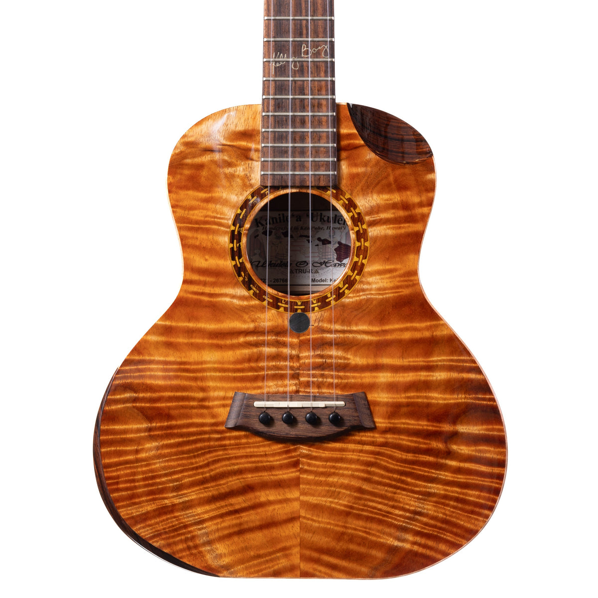 Example photo: an earlier Kanile'a Kelly Boy super tenor, serial 26766, body front with Premium Grade koa, chain rosette and cocobolo cutaway
