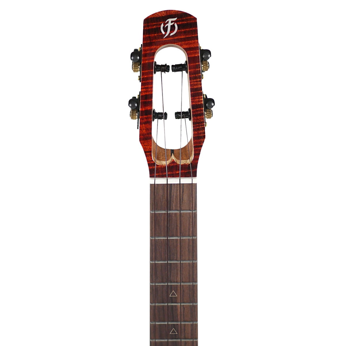The headstock close-up displays the unique slotted design and tuning hardware of the Flight Navigator Tenor.