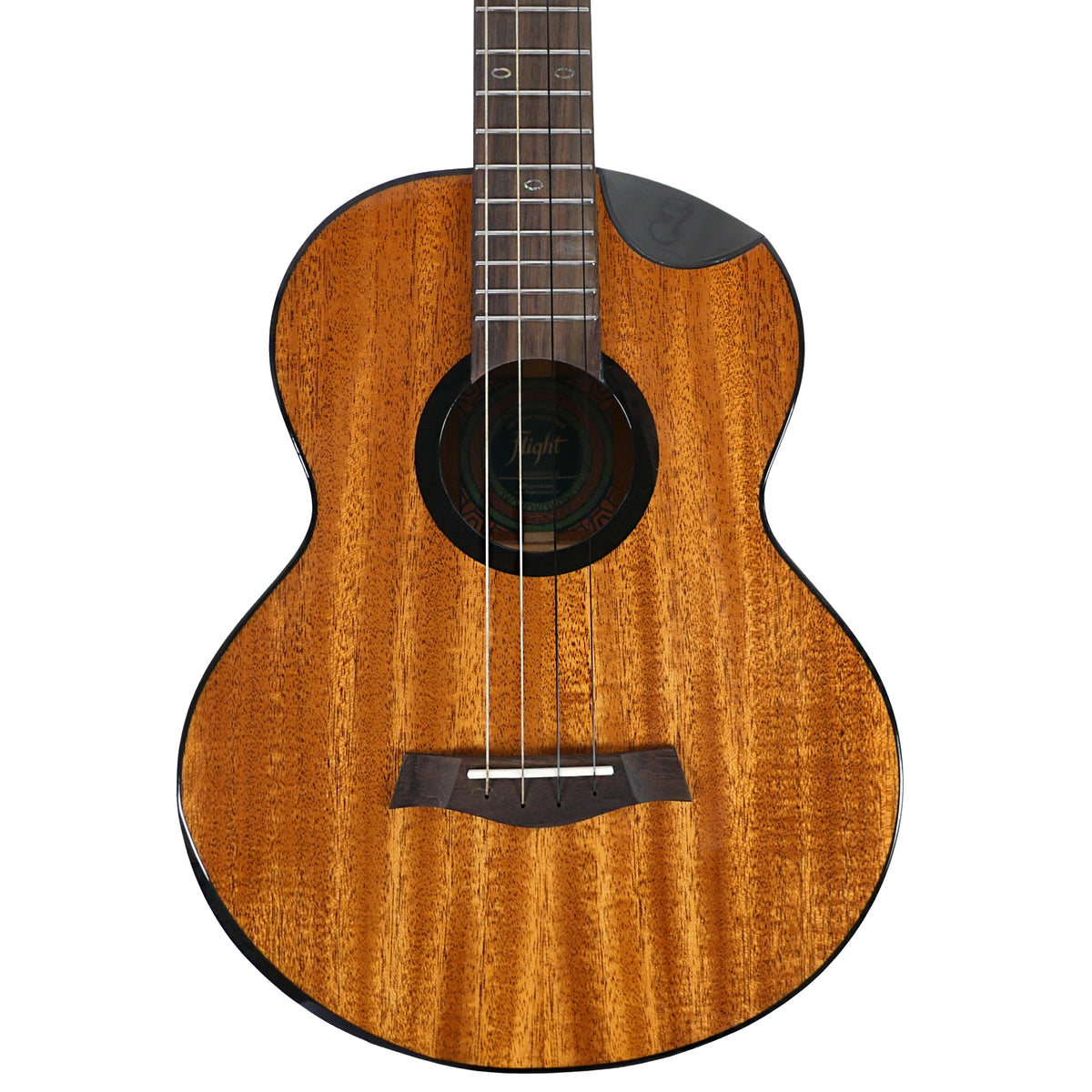 The close-up highlights the solid mahogany top, dyed maple rosette, and black cutaway of the Flight Nomad Baritone.