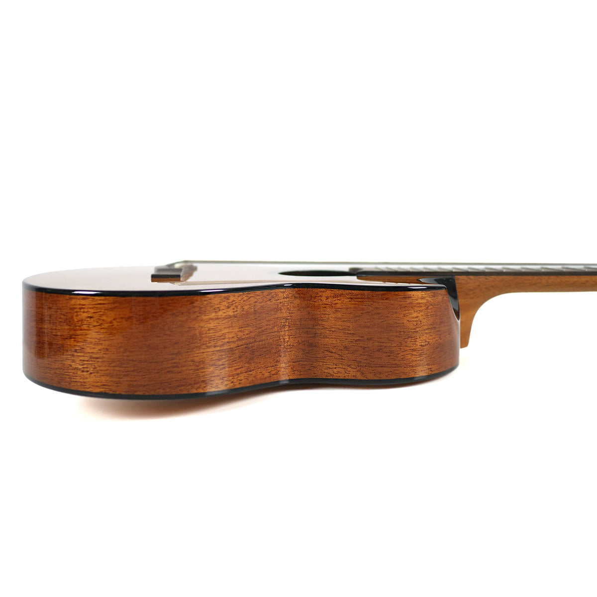 The side profile displays the solid mahogany sides, gloss finish, and black binding of the Flight Nomad Baritone.