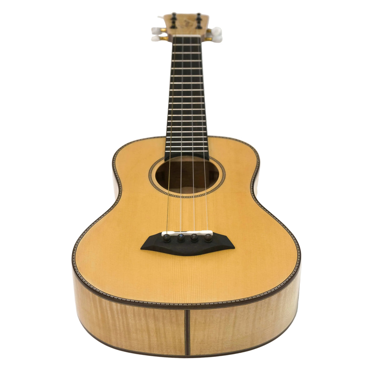 Romero Creations Classic Tenor ukulele, angled full-length view on a white table