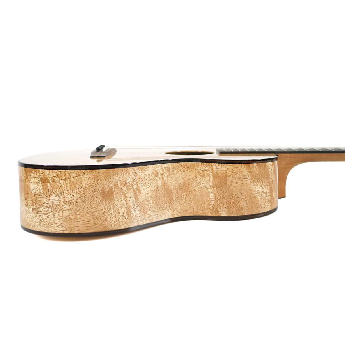 Pono UL4-3 solid mango big baritone ukulele, side view of the body depth and gloss finish