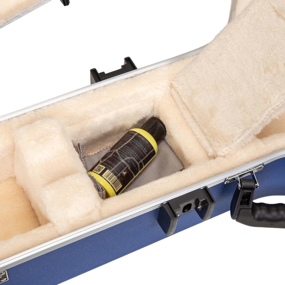 Close-up of the CRA980BJVB neck-block accessory compartment holding a bottle of lemon oil and a polishing cloth.