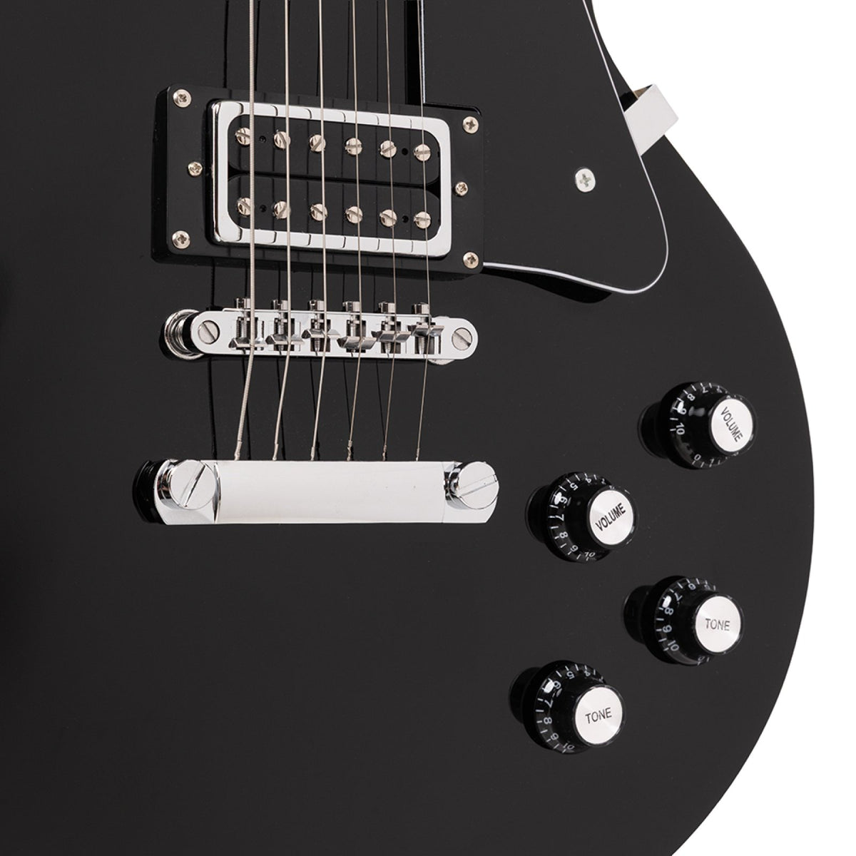 Close-up of the humbucker, tune-o-matic bridge, stop tailpiece and control knobs on the black Stagg SEL-STD