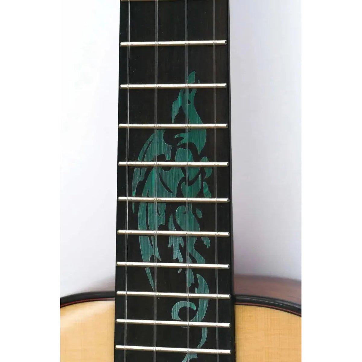 Flight A10 SC Tenor Ukulele ebony fretboard with turquoise dragon inlay.