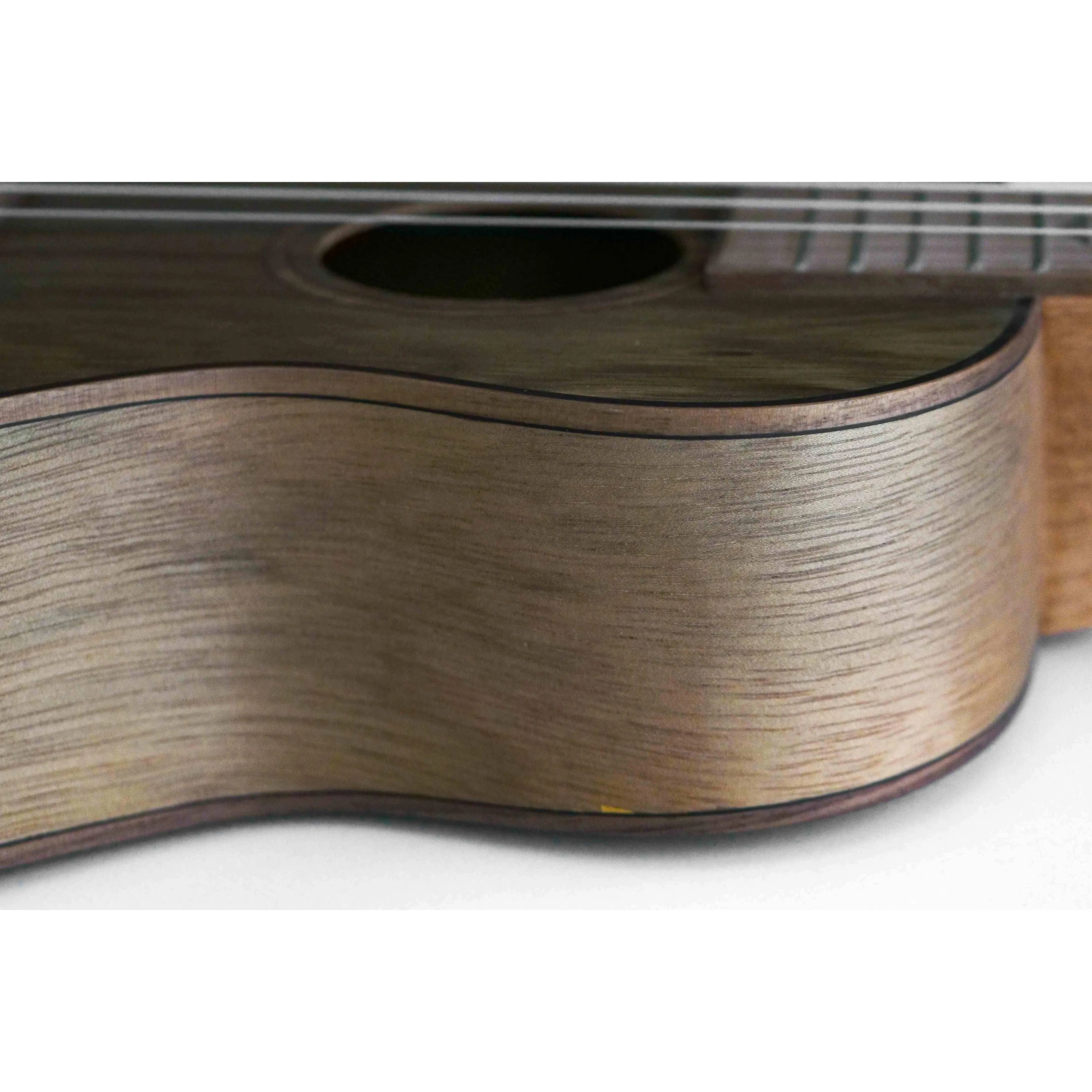 Flight DUC430 Dao Concert Ukulele, close-up of the light green figured wood body with satin finish.