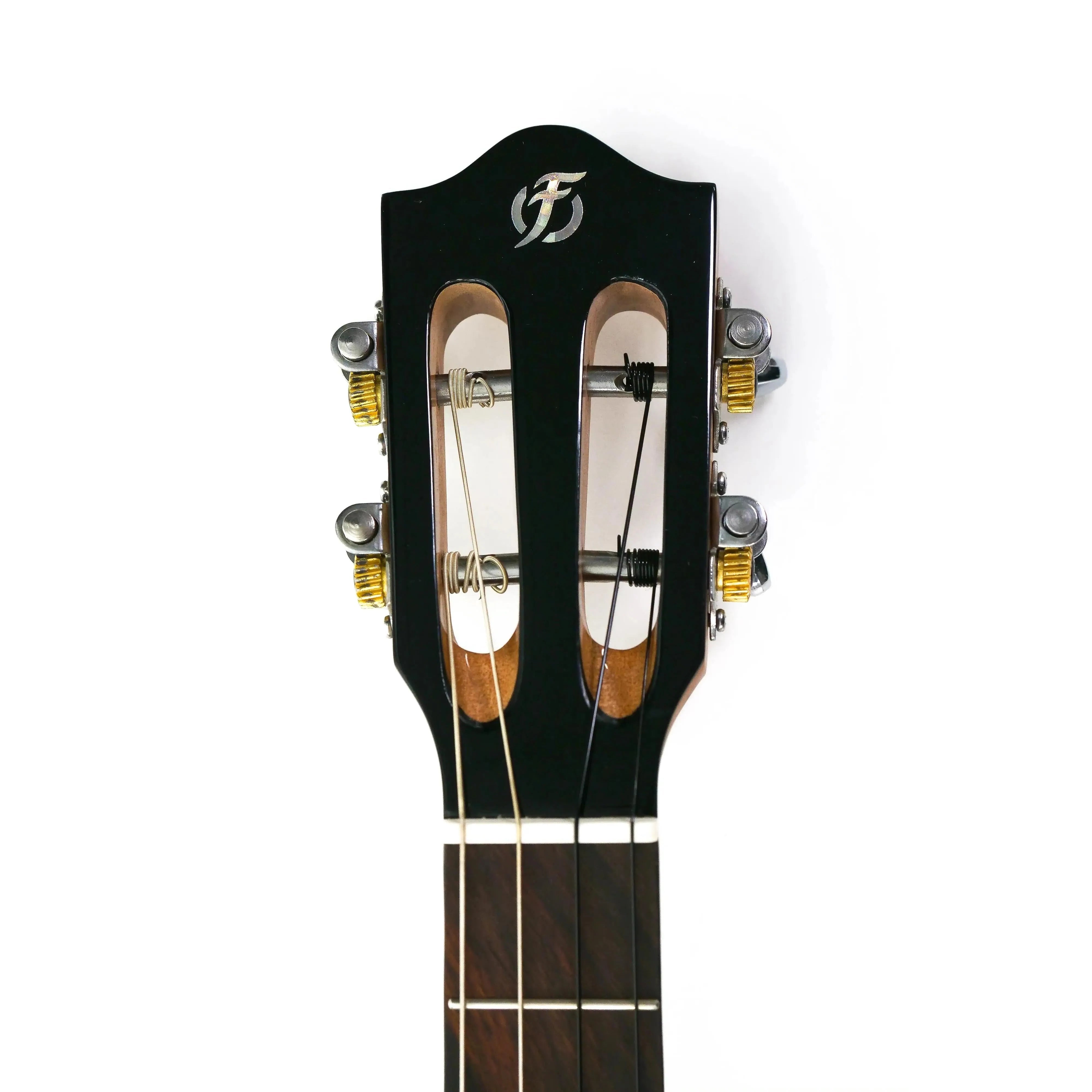 Flight IRIS BK Baritone Ukulele headstock with black finish, gold tuners, and brand logo.
