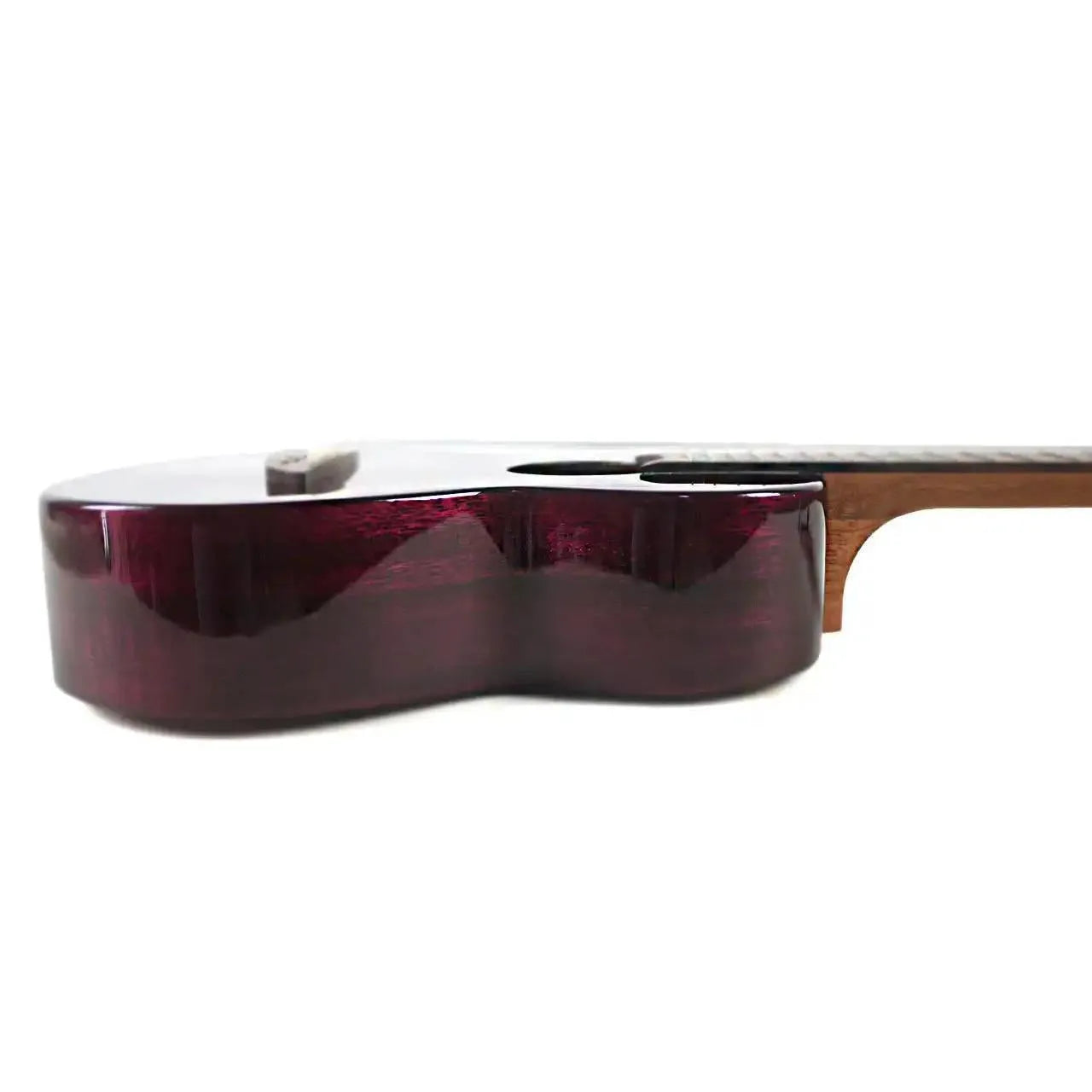 Flight IRIS TINTA TPP transparent purple tenor ukulele body, side view, showing glossy finish.