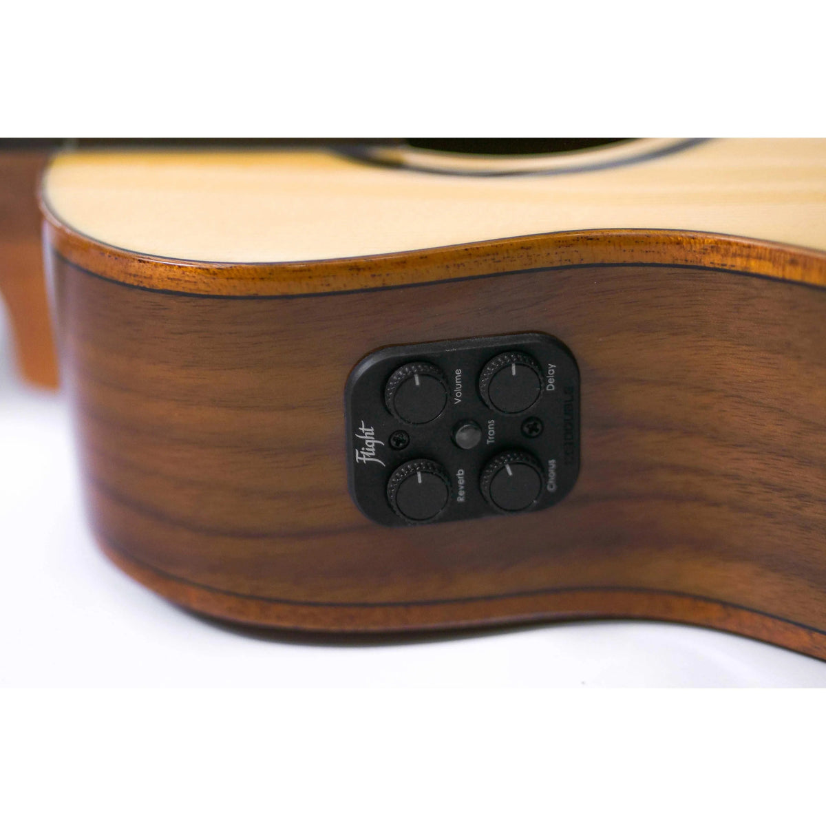 Close-up of Flight Sophia TE Soundwave Tenor Ukulele's dark wood body with black control panel and knobs.