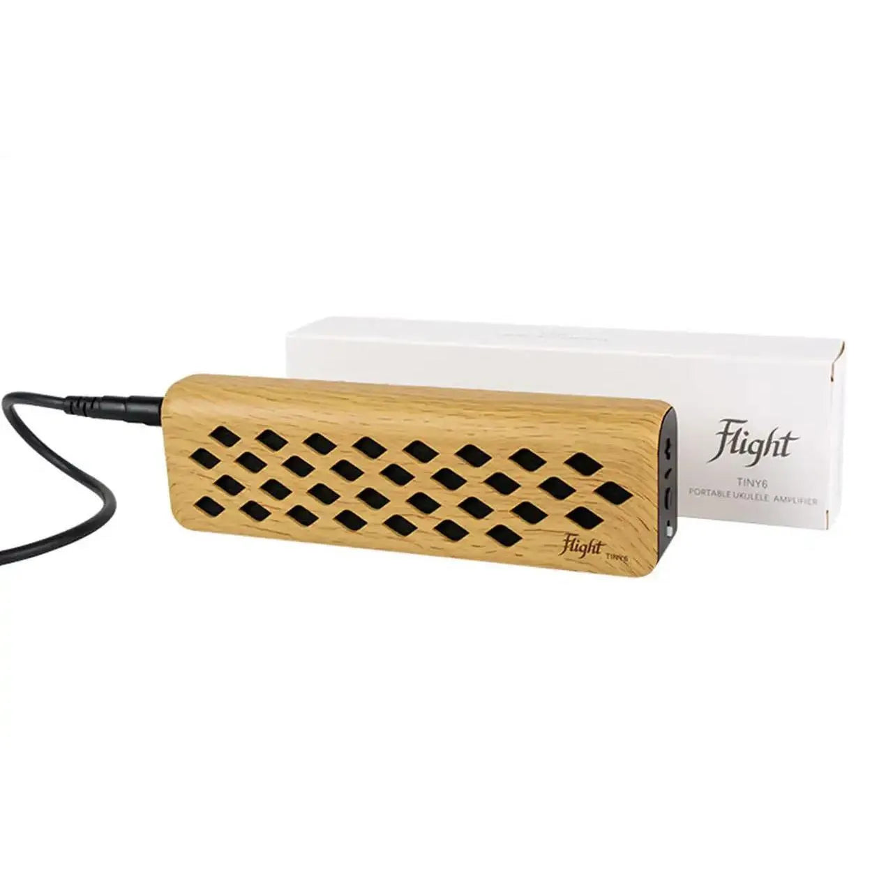 Flight TINY6 portable maple mini amplifier with diamond-patterned grille, charging cable, and white box.