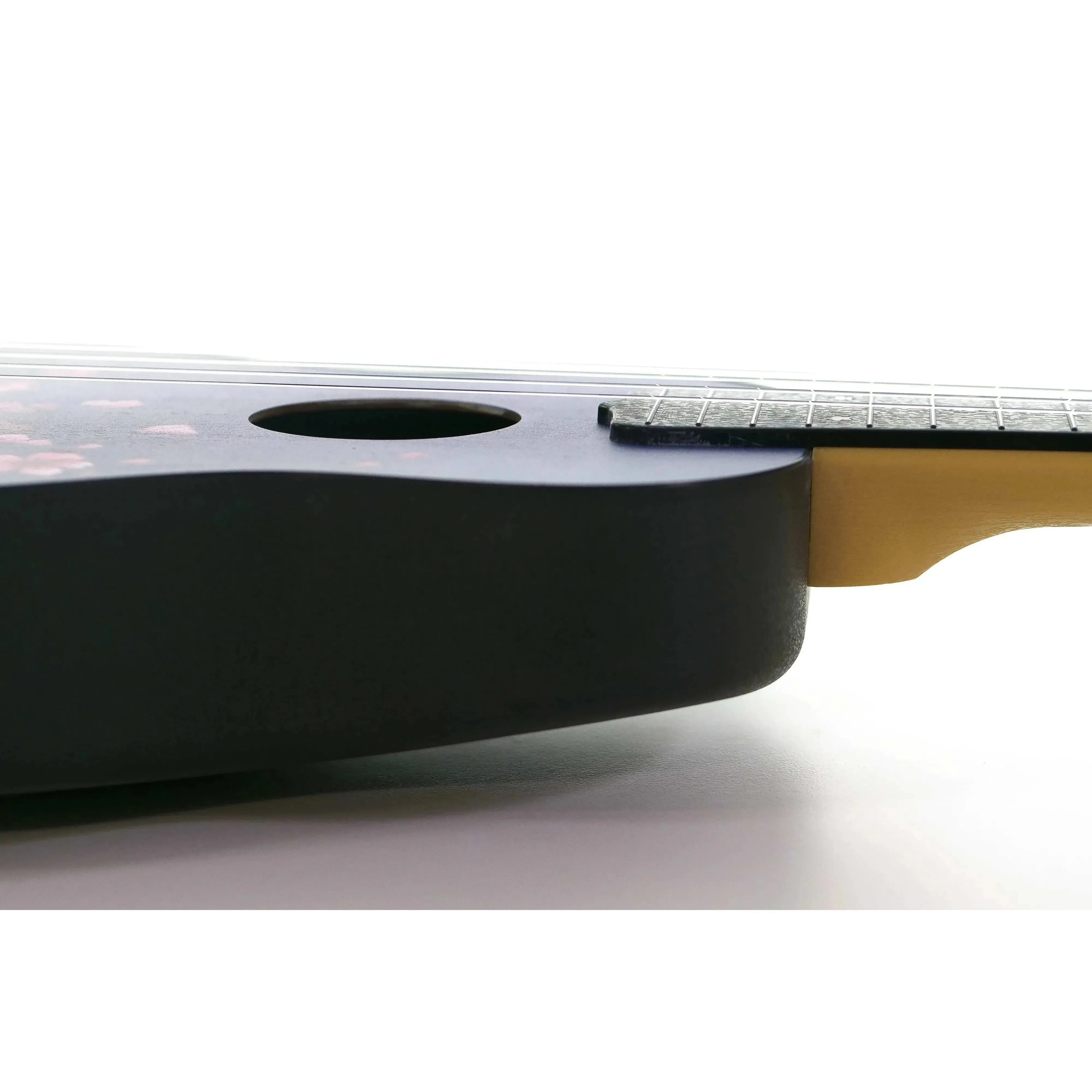 Flight TUS32 Sakura Travel Soprano Ukulele body with black finish and cherry blossom print.