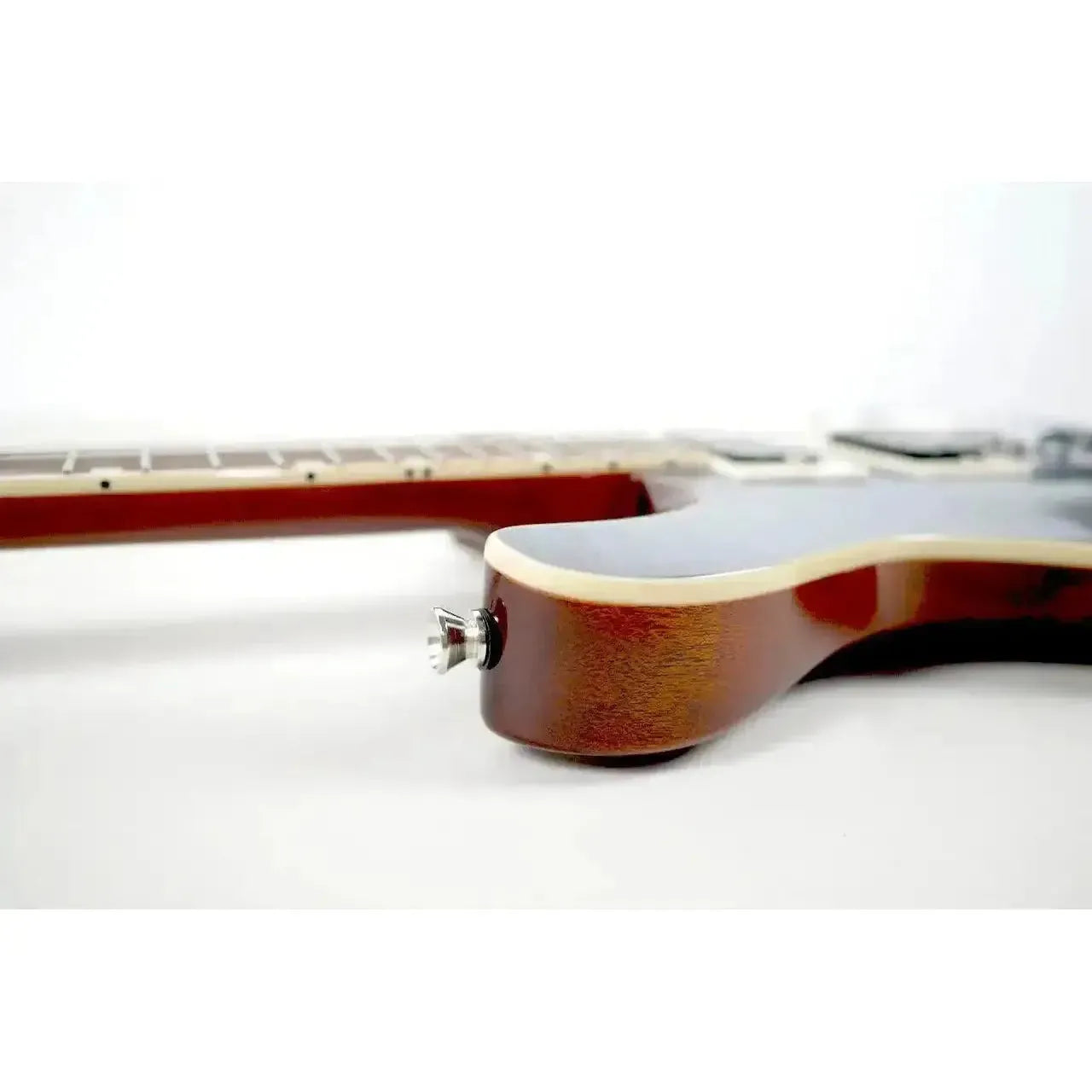 Flight Vanguard TBK electric tenor ukulele body with transparent black finish and chrome jack.