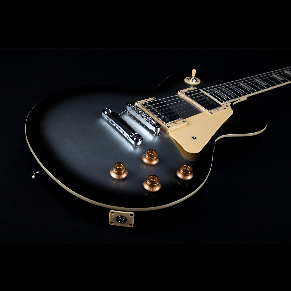 Jet JL-500 SLB Silverburst singlecut body at an angle showing two humbuckers and gold control knobs.