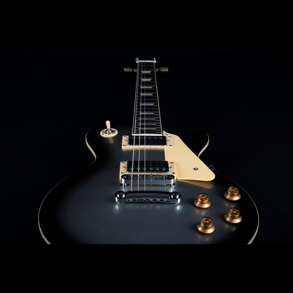 Close-up of the Jet JL-500 SLB humbuckers, cream pickguard and stoptail bridge.