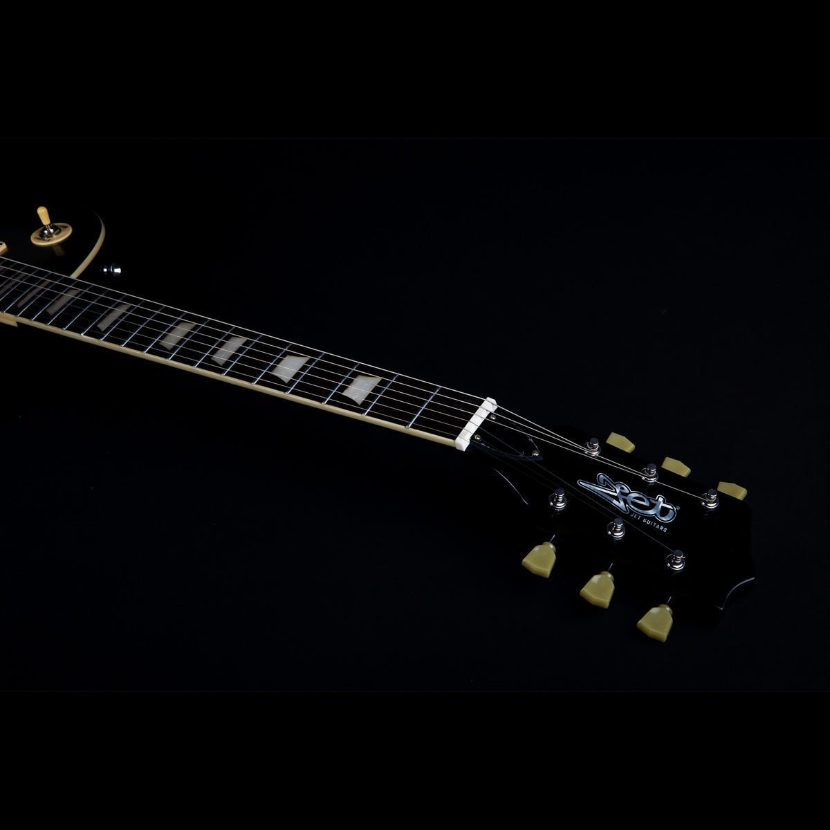 Jet JL-500 SLB Silverburst singlecut electric guitar lying flat, front view.