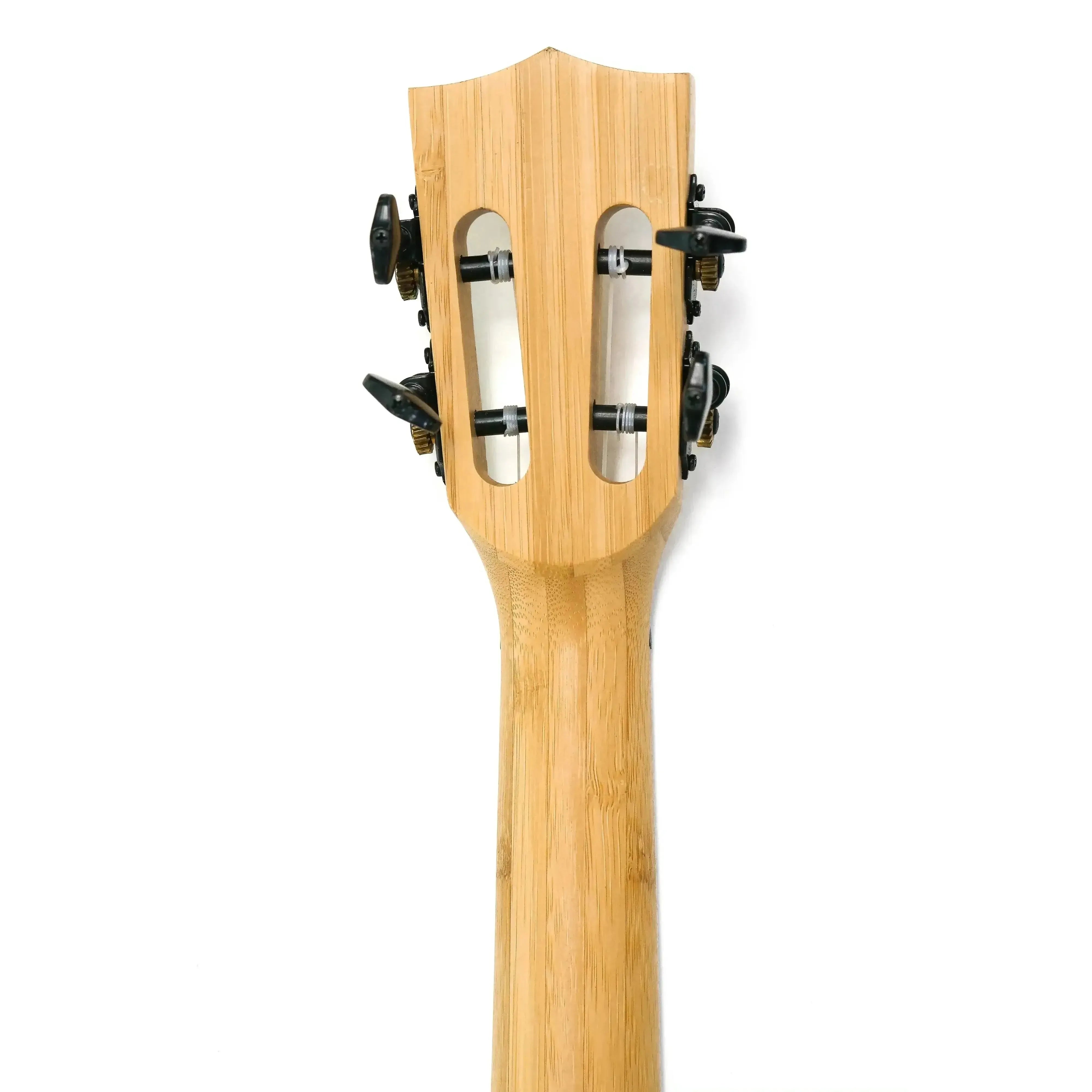 Kala BMB-T solid bamboo tenor ukulele headstock with slotted design and black tuners.