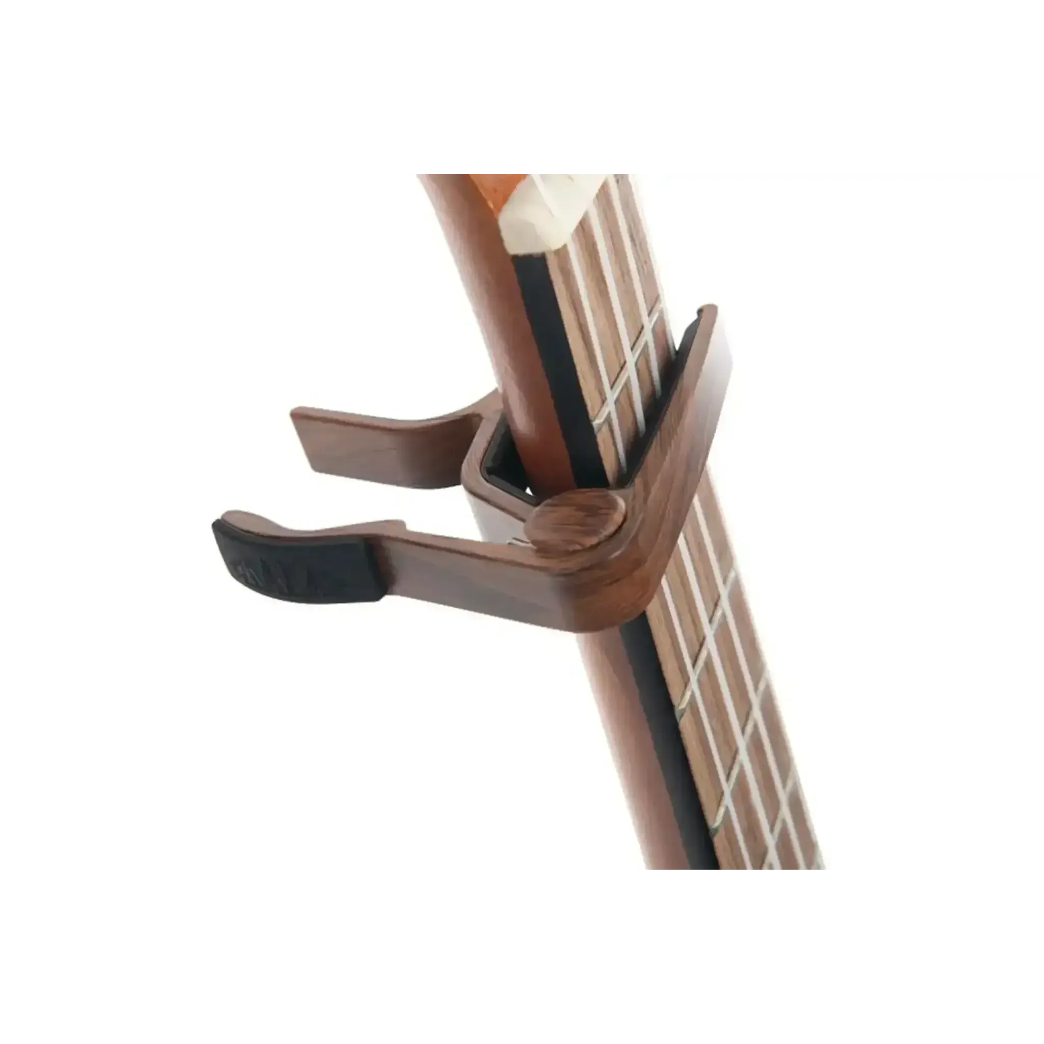 Kala K-CAPO-WLT walnut ukulele capo clamped on a ukulele fretboard, showing its curved design.