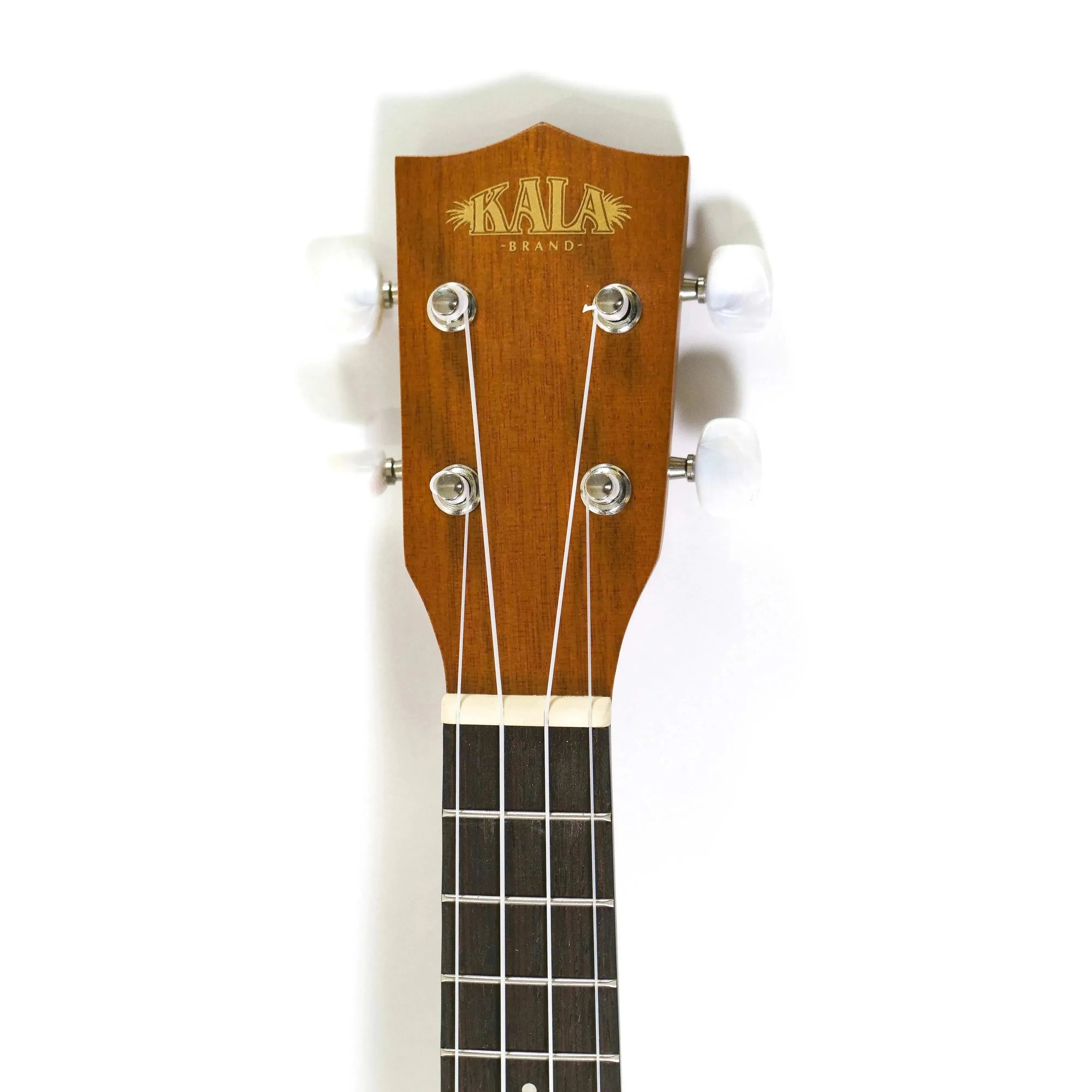 Kala KA-S Soprano Ukulele headstock with mahogany finish, gold logo, and white tuning pegs.