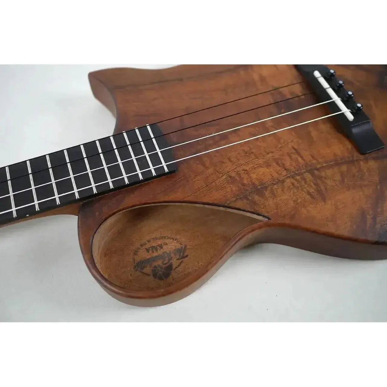 Kala Revelator Nautilus Baritone Ukulele, close-up of Hawaiian Koa body with Florentine cutaway.
