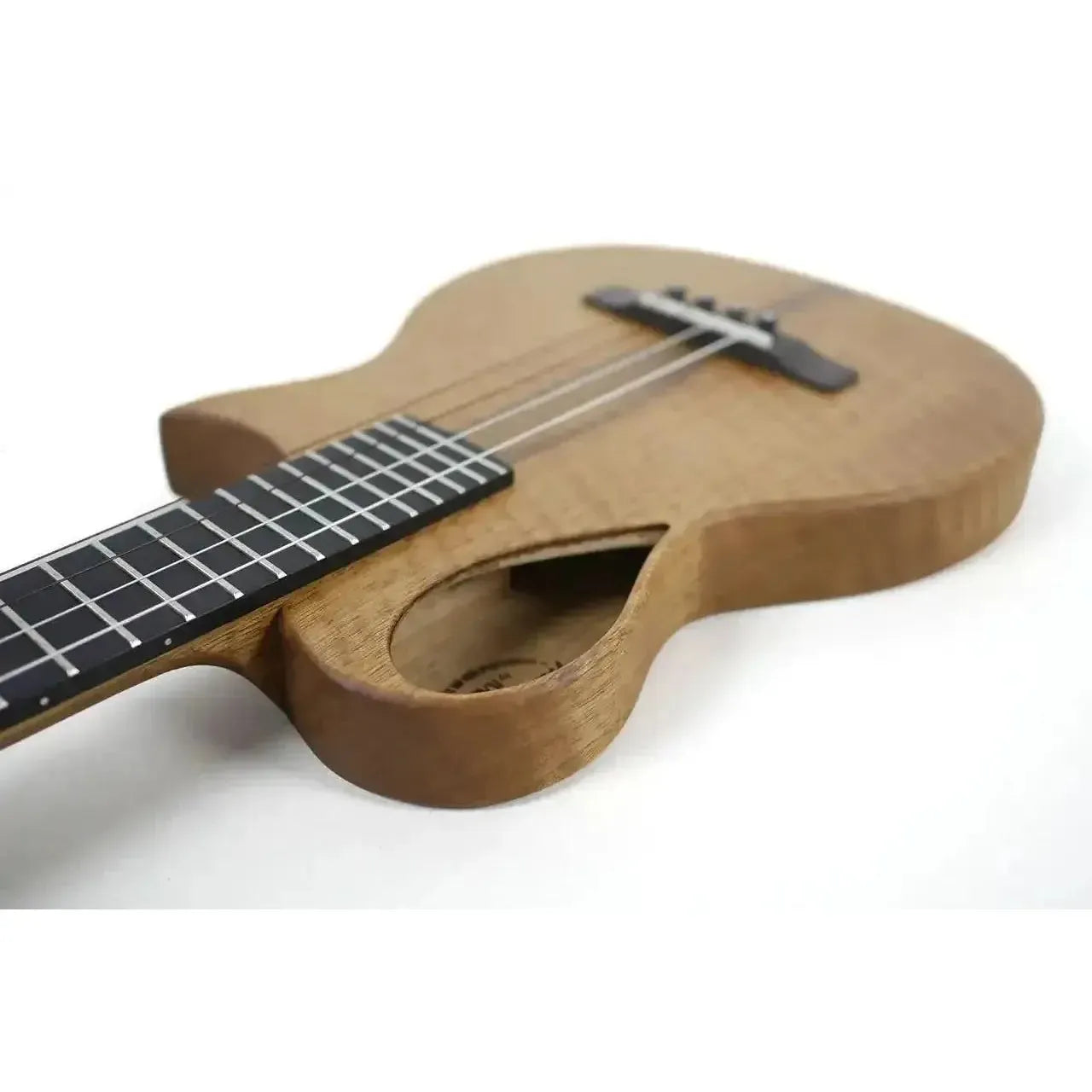 Kala Revelator Nautilus Mastergrade Korina Tenor Ukulele with Florentine cutaway, ebony fingerboard.