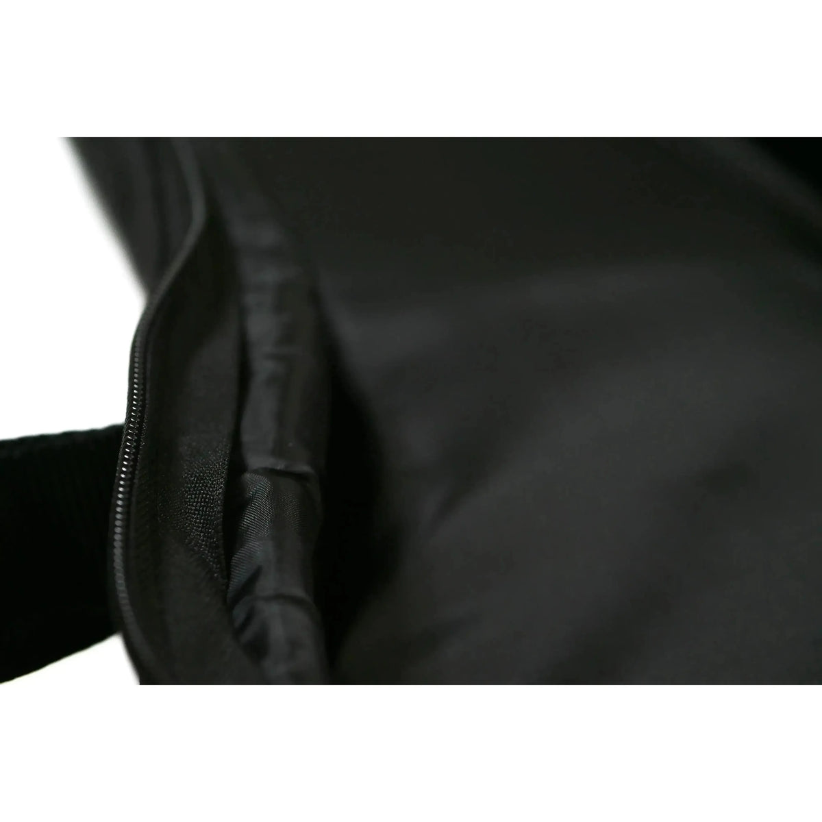 Kala UB-T black padded tenor ukulele gig bag, showing open accessory pocket and durable Cordura material.