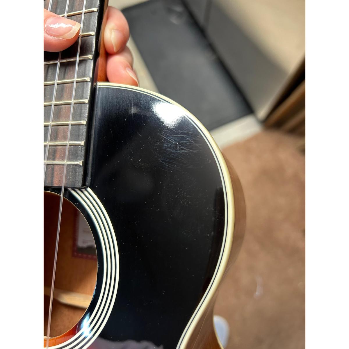 Kala Uke Like The Pros tenor ukulele body with sunburst finish, showing light surface swirls.