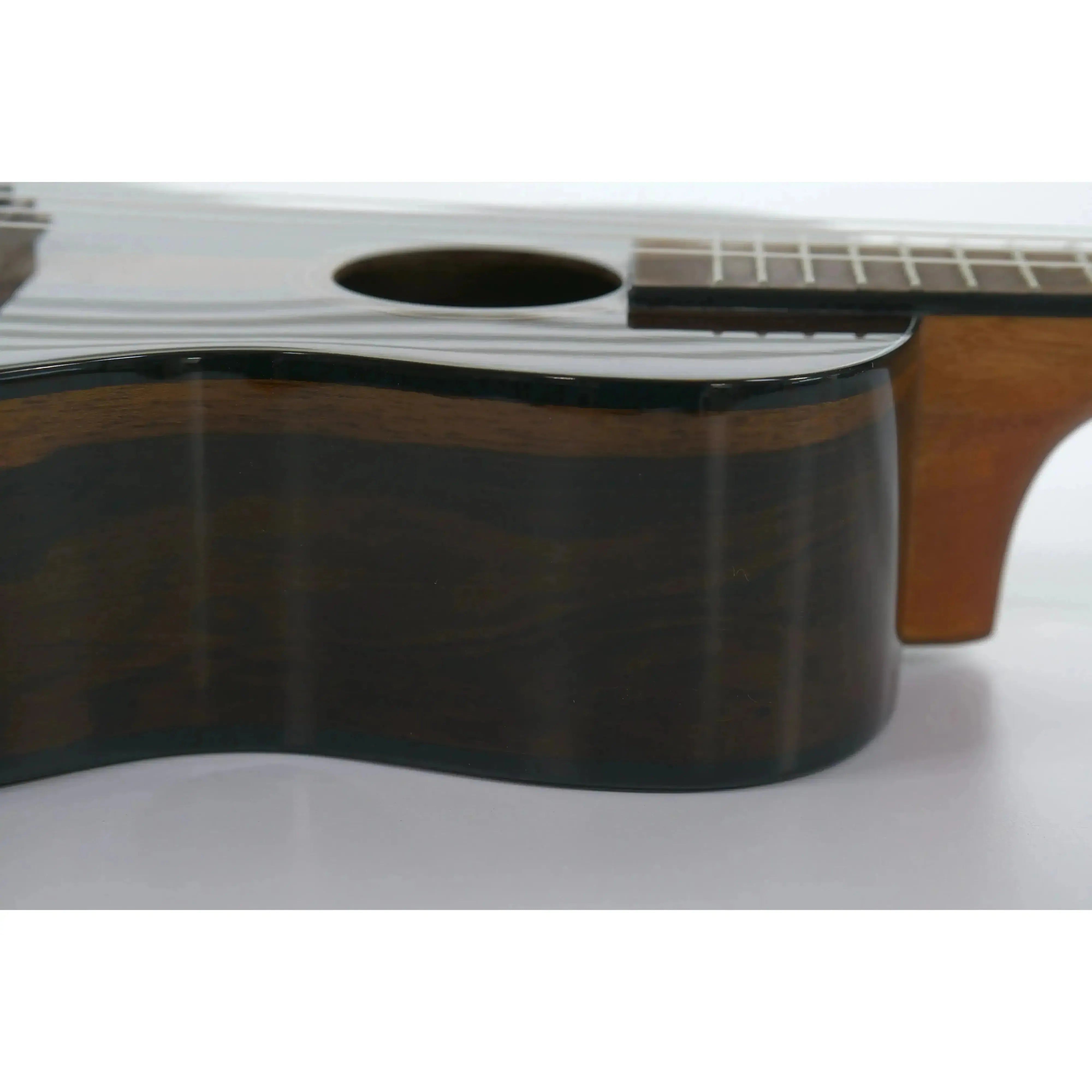 Kala Ziricote Concert Ukulele with gloss finish, dark wood grain, and black binding.