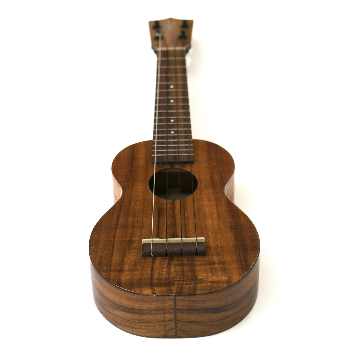 Pre-owned Kamaka HF-1 soprano ukulele full front view standing upright, solid Hawaiian koa body