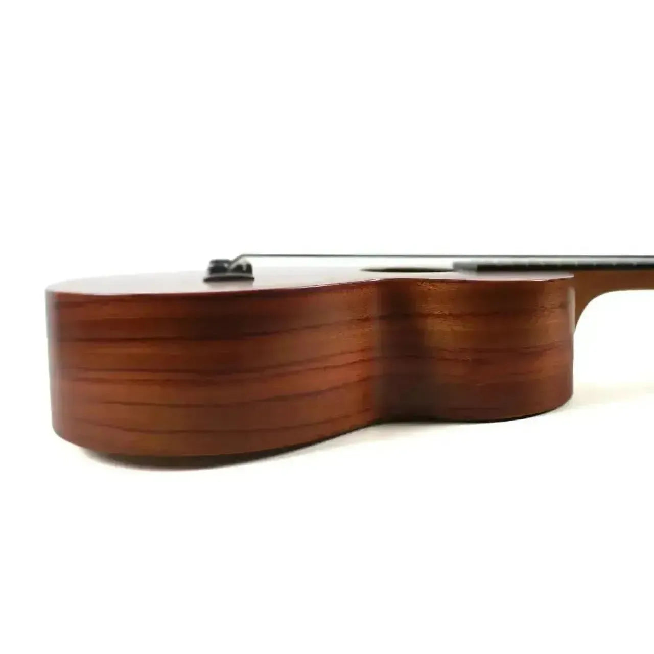 Side view of a Kamaka HF-3 tenor ukulele, showcasing its solid Hawaiian koa wood body with a satin finish.