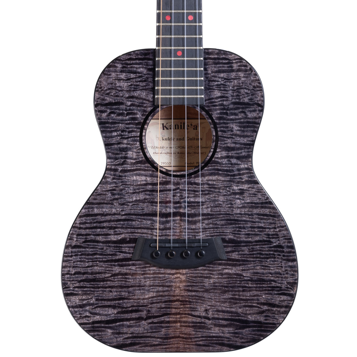 Example photo: a Kanile'a Pohaku Pro tenor, serial 29553, body front with black-stained quilted maple and ebony rosette