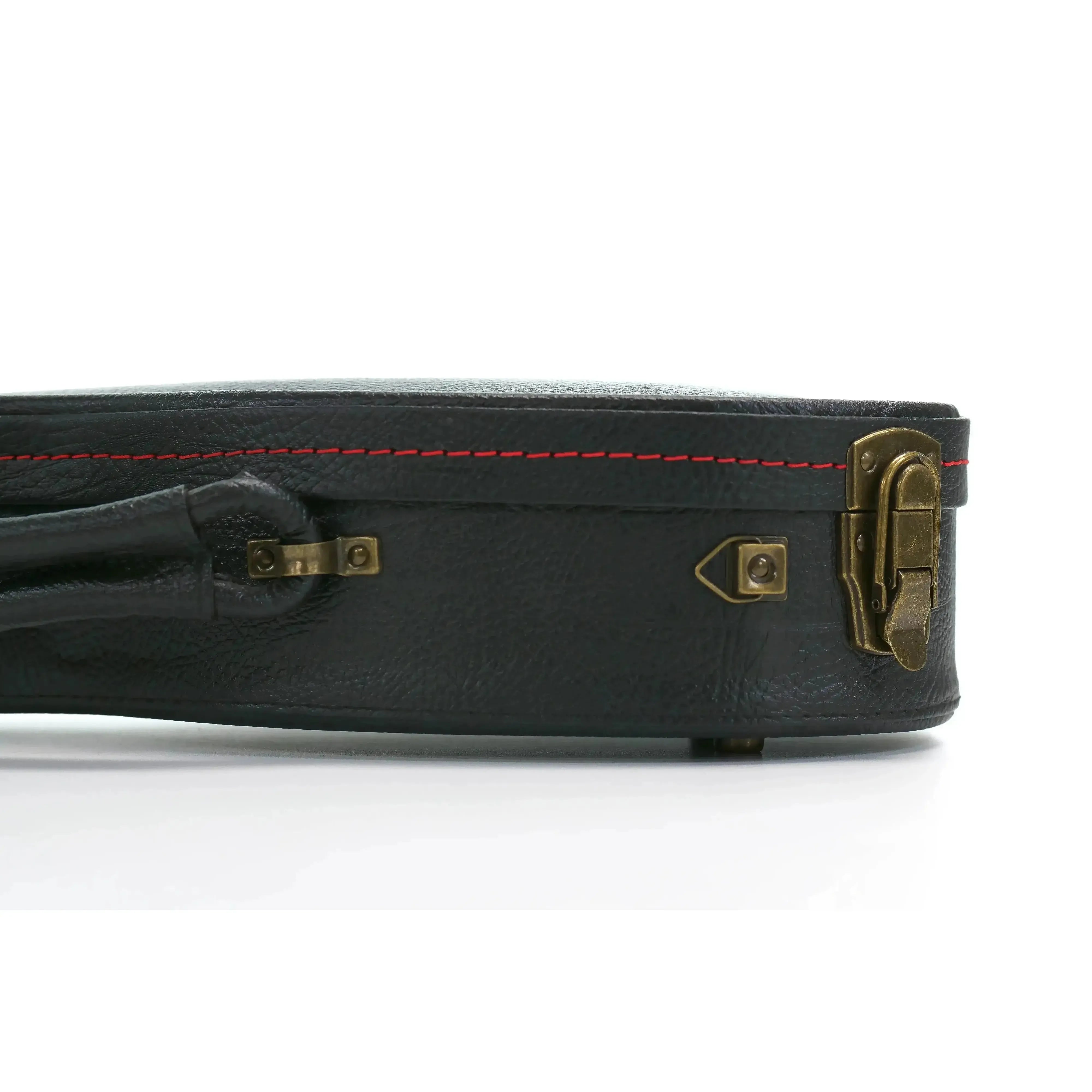 KoAloha black tolex hardshell soprano pineapple longneck ukulele case with vintage brass latches and red stitching.
