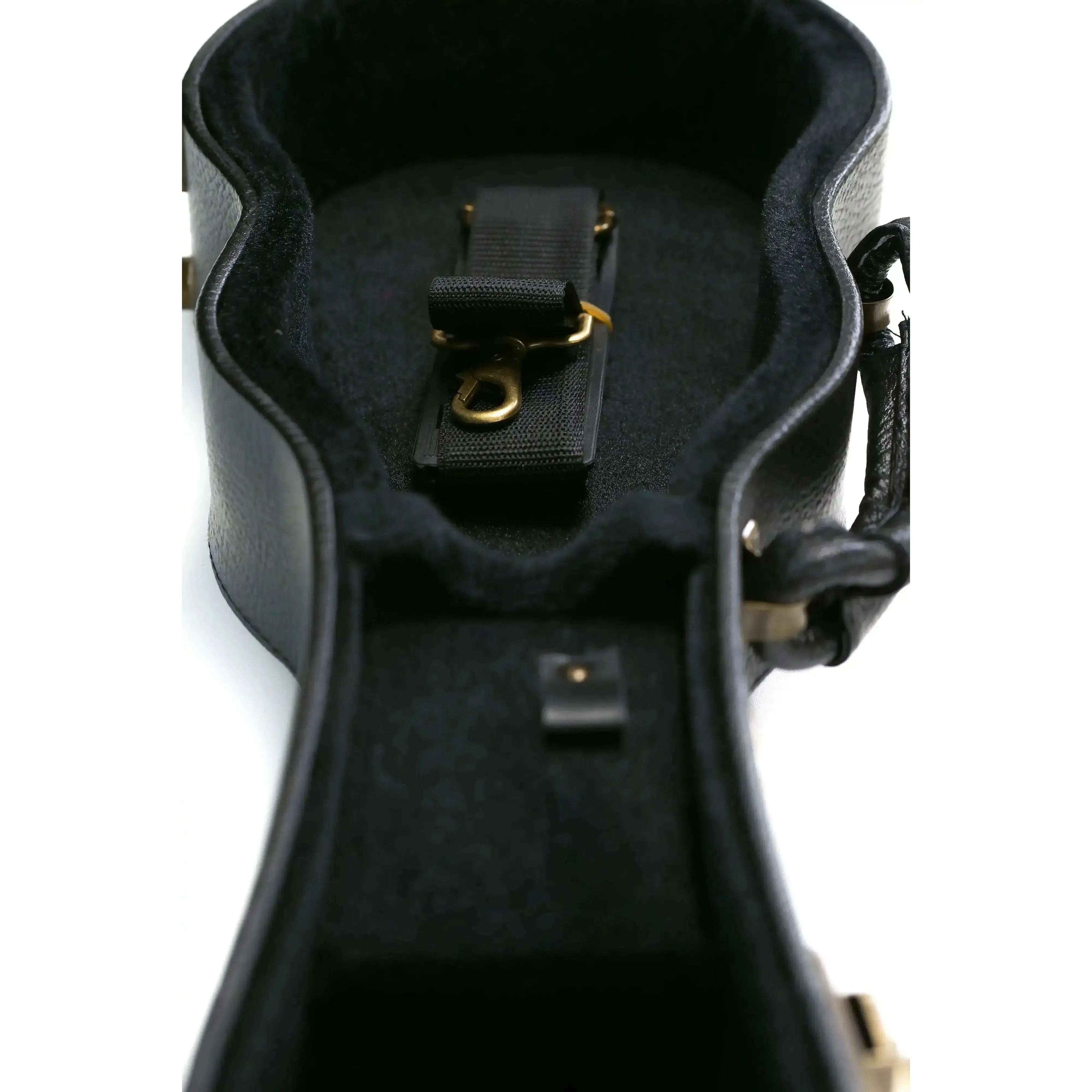 Open KoAloha black tolex archtop soprano ukulele hardshell case with plush interior and brass hardware.