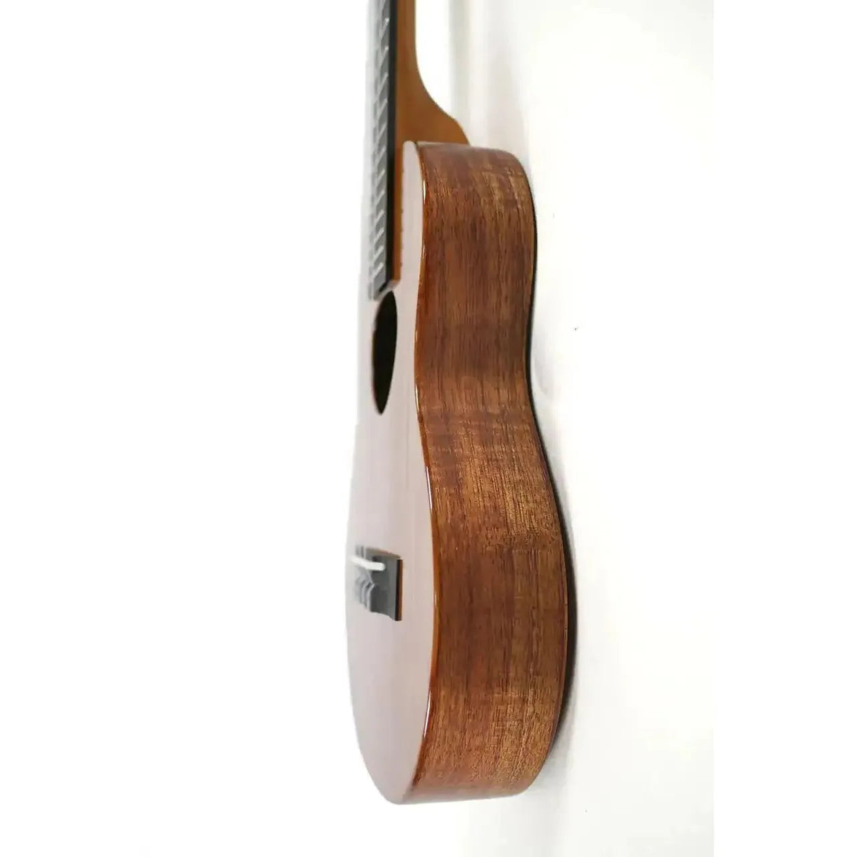 KoAloha KTM-S00 Slimline Gloss Solid Hawaiian Koa Tenor Ukulele, side view of the slim koa body standing upright