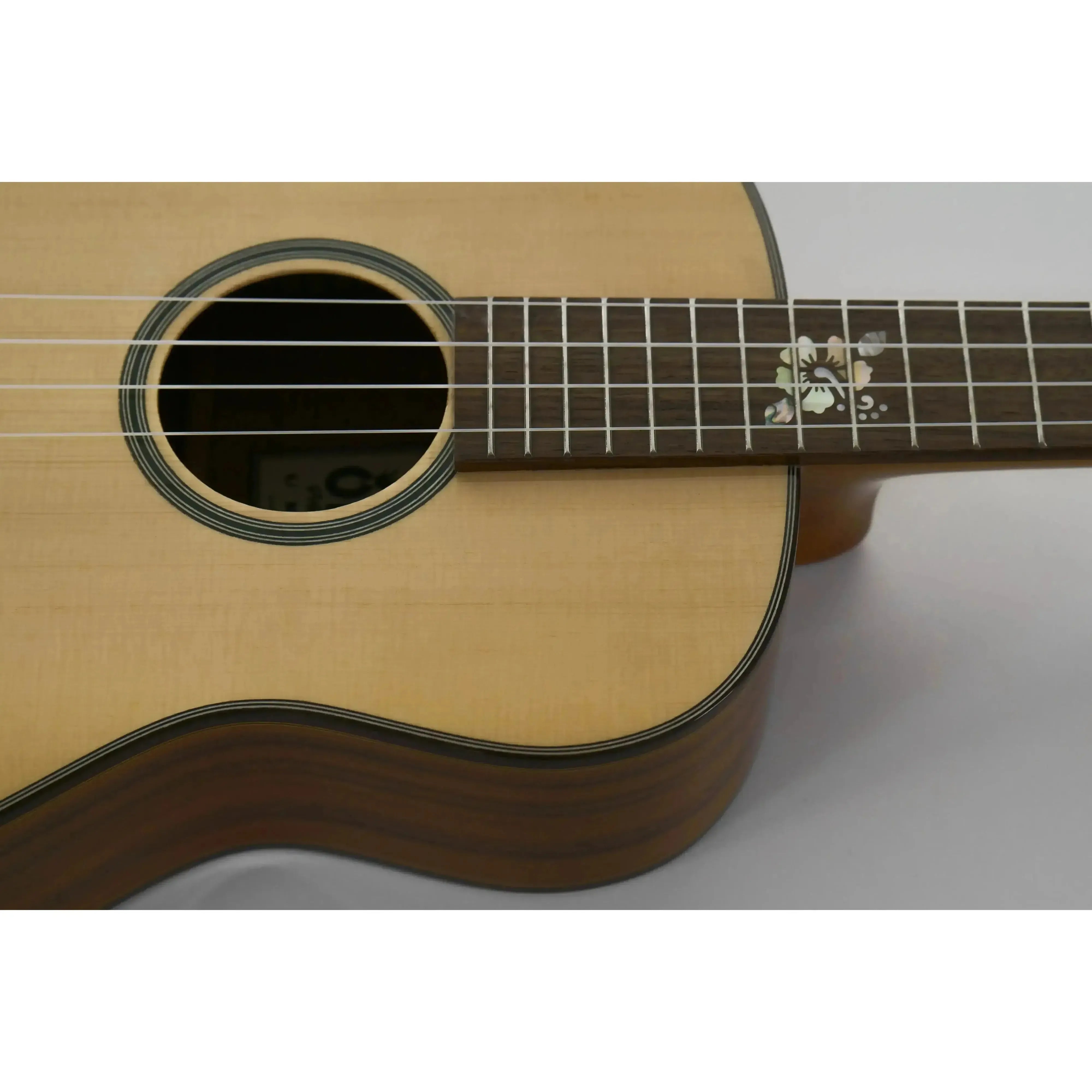 Ohana BKT-250G Baritone Ukulele with light spruce top, dark acacia sides, and floral fretboard inlay.