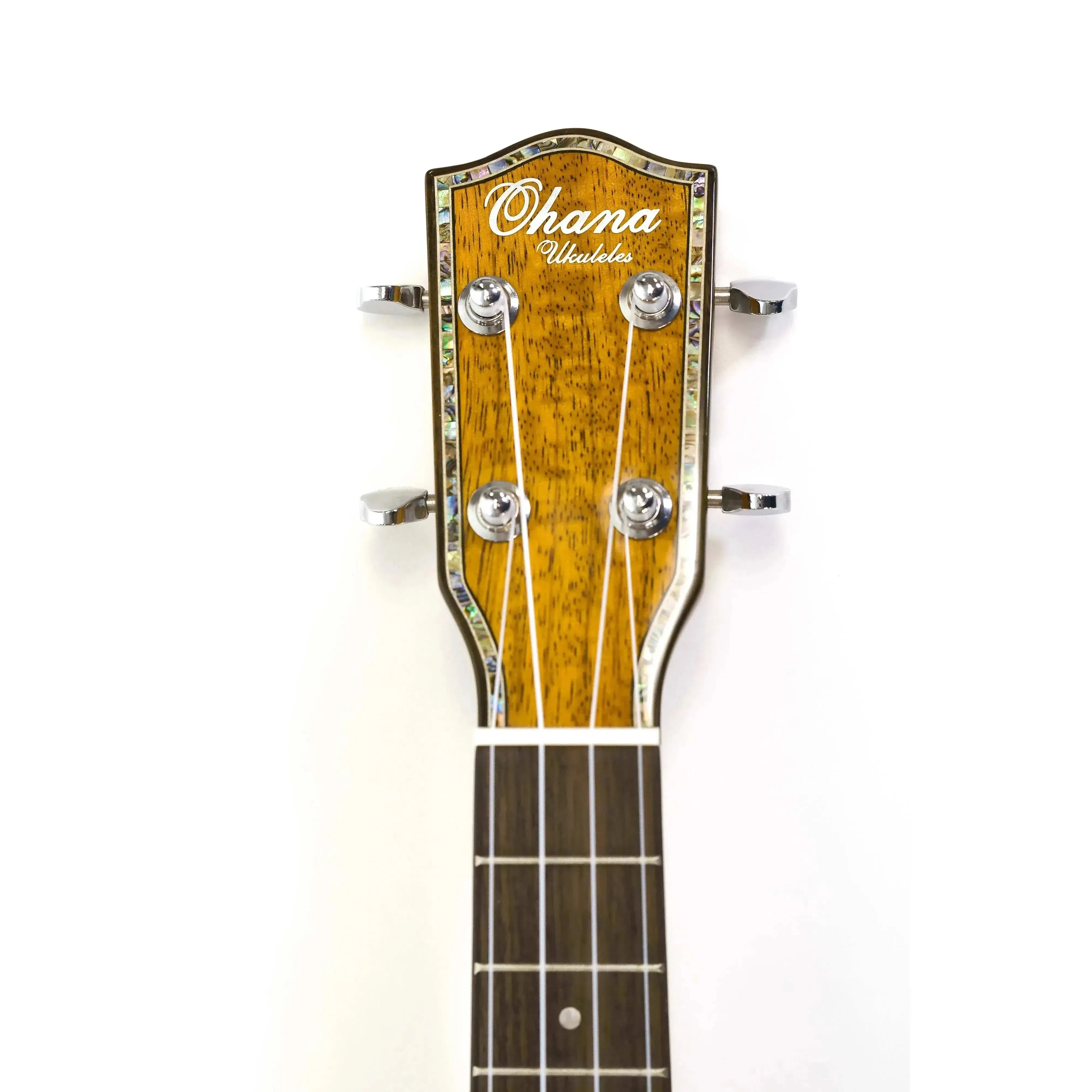 Ohana ukulele headstock with glossy mango wood, abalone inlay, chrome tuners, and dark fretboard.