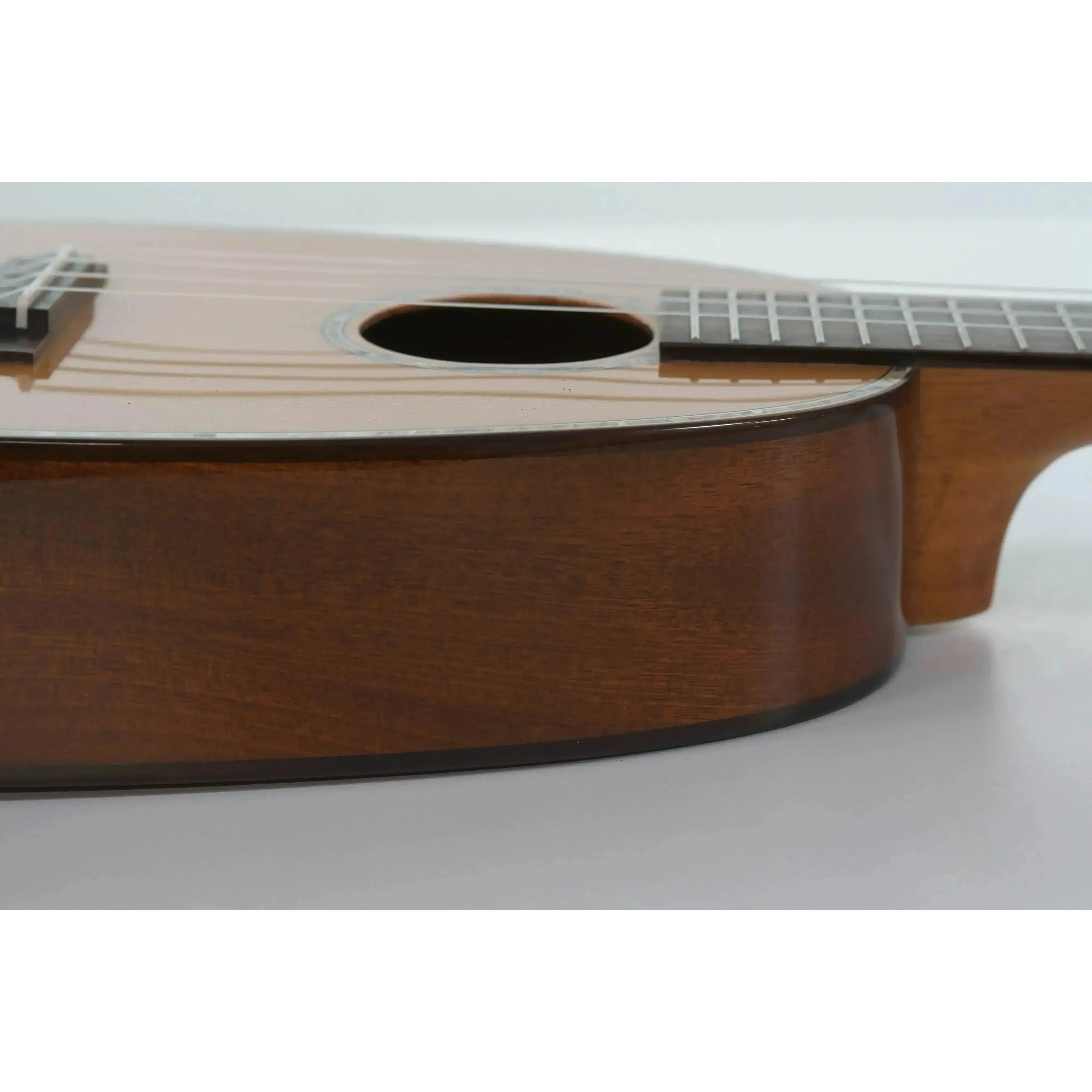 Ohana PKC-50G pineapple concert ukulele body, showing its solid cedar top and mahogany sides.