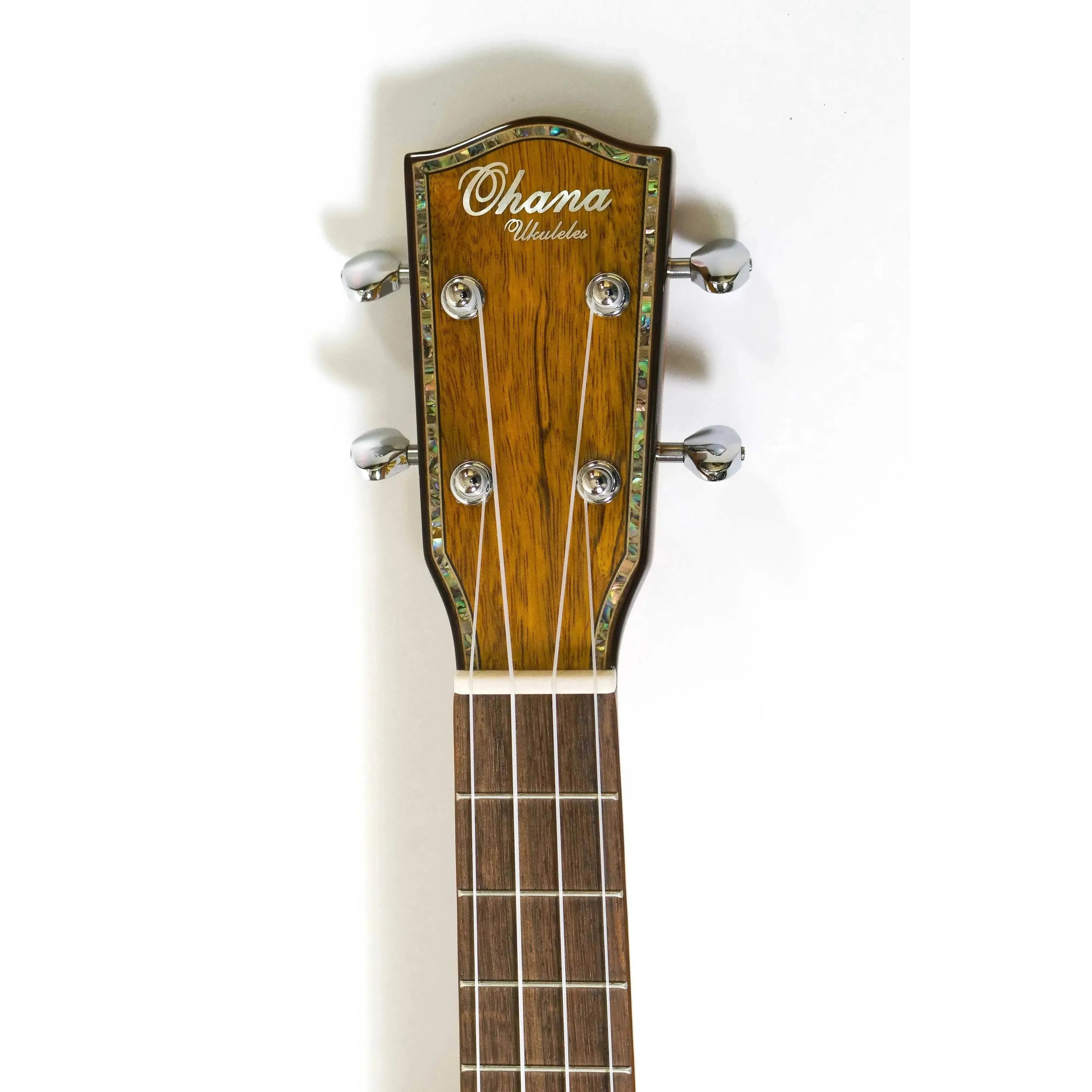 Ohana Ukuleles mango headstock with abalone purfling, wood binding, and chrome tuners.