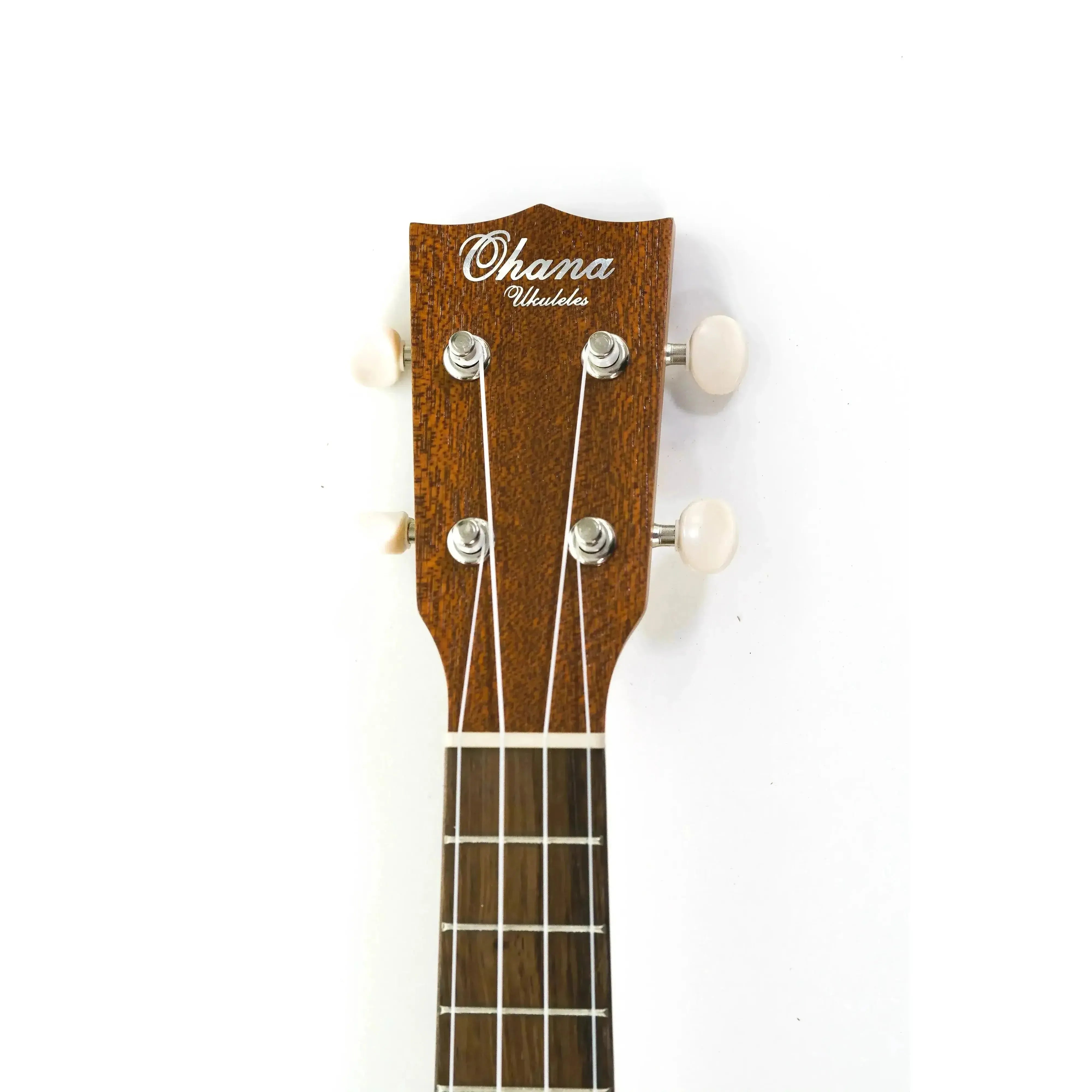 Ohana SK-10 mahogany soprano ukulele headstock with open-slotted design and white tuners.
